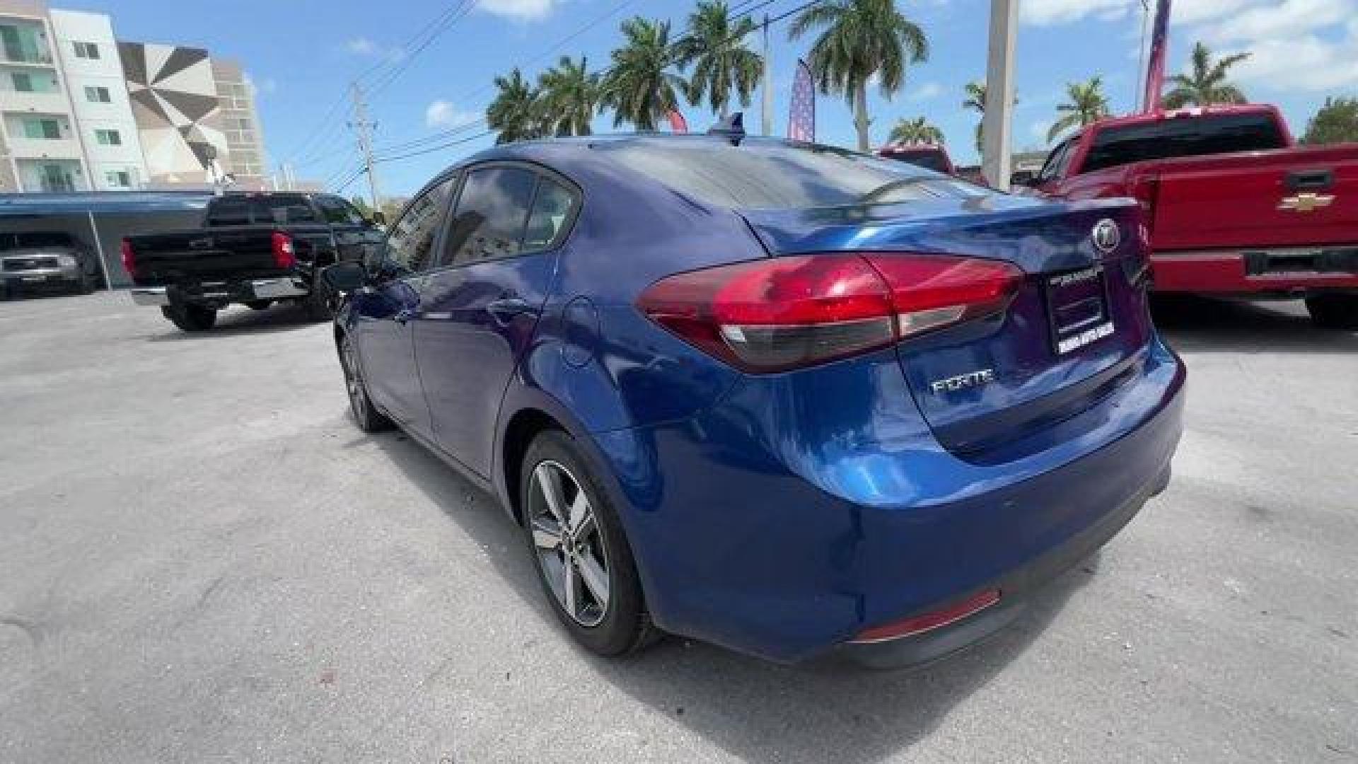 2018 Deep Sea Blue /Black Kia Forte LX (3KPFL4A73JE) with an 4 2.0 L engine, Automatic transmission, located at 27610 S Dixie Hwy, Homestead, FL, 33032, (305) 749-2348, 25.510241, -80.438301 - Delivers 37 Highway MPG and 29 City MPG! This Kia Forte delivers a Regular Unleaded I-4 2.0 L/122 engine powering this Automatic transmission. LX POPULAR PACKAGE -inc: covered console w/dual 12v outlet and drive mode select, Auto-On/Off Headlights, Dual Illuminated Visor Vanity Mirrors, Front Passen - Photo#2