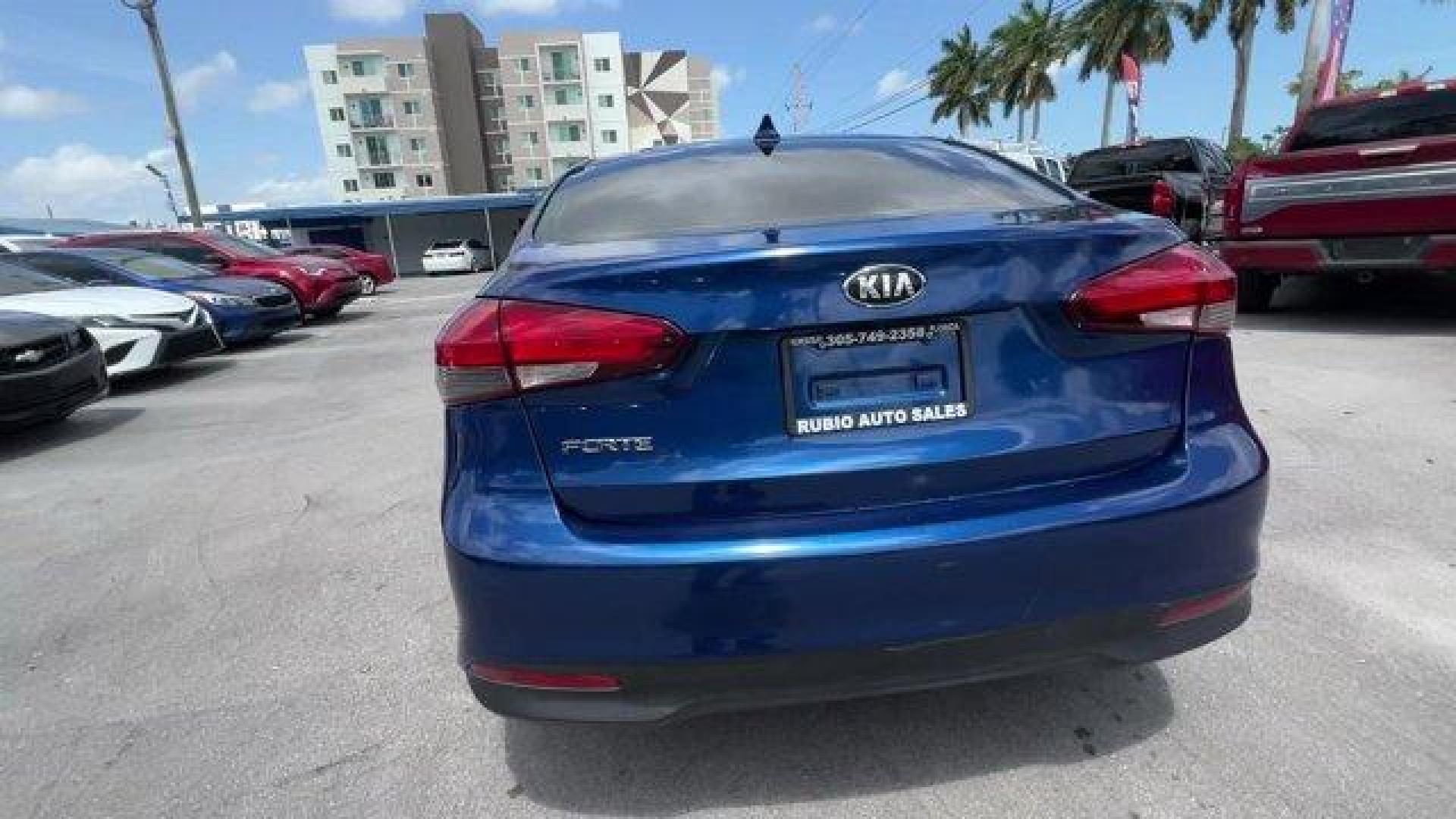 2018 Deep Sea Blue /Black Kia Forte LX (3KPFL4A73JE) with an 4 2.0 L engine, Automatic transmission, located at 27610 S Dixie Hwy, Homestead, FL, 33032, (305) 749-2348, 25.510241, -80.438301 - Delivers 37 Highway MPG and 29 City MPG! This Kia Forte delivers a Regular Unleaded I-4 2.0 L/122 engine powering this Automatic transmission. LX POPULAR PACKAGE -inc: covered console w/dual 12v outlet and drive mode select, Auto-On/Off Headlights, Dual Illuminated Visor Vanity Mirrors, Front Passen - Photo#3