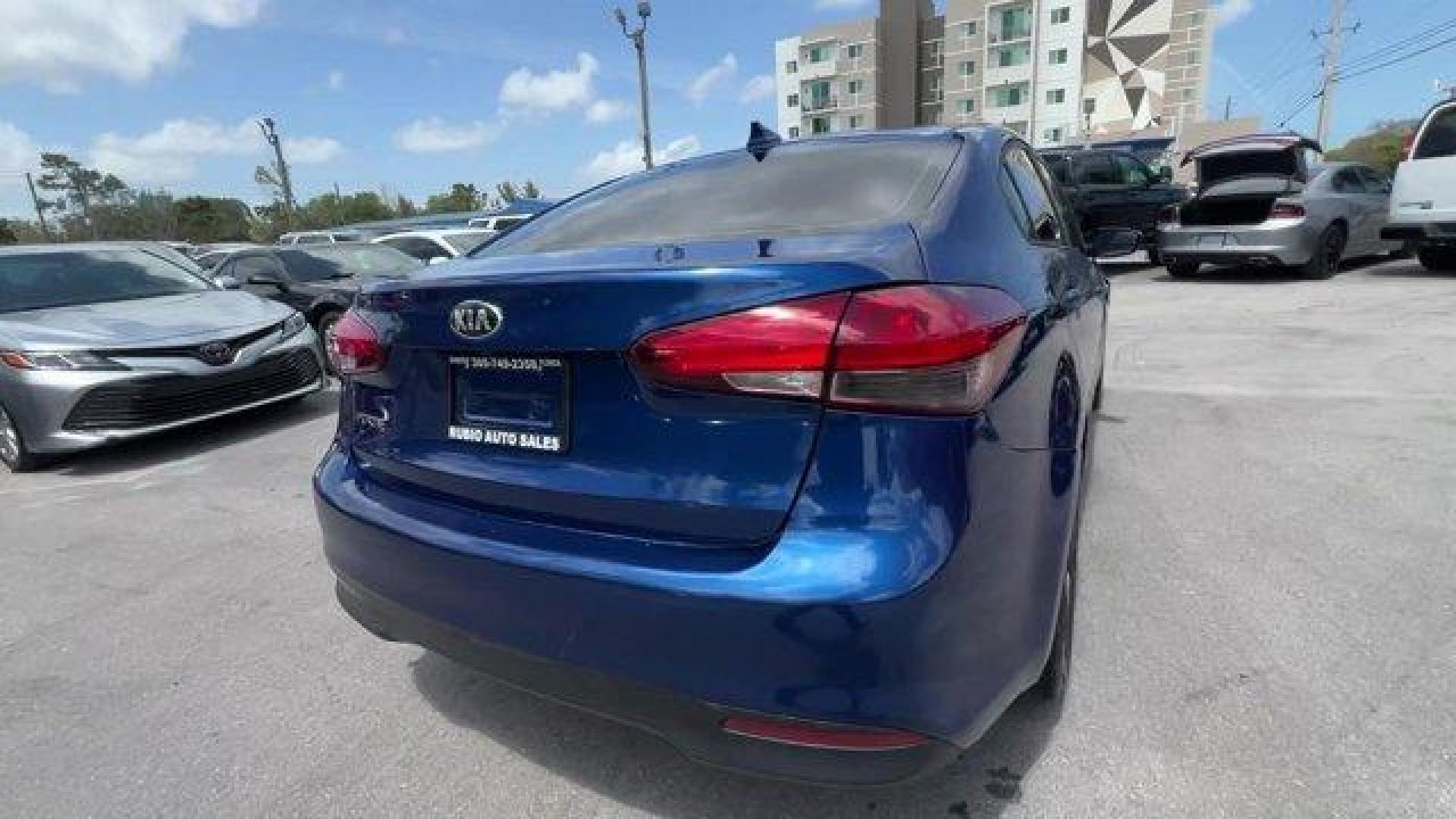2018 Deep Sea Blue /Black Kia Forte LX (3KPFL4A73JE) with an 4 2.0 L engine, Automatic transmission, located at 27610 S Dixie Hwy, Homestead, FL, 33032, (305) 749-2348, 25.510241, -80.438301 - Delivers 37 Highway MPG and 29 City MPG! This Kia Forte delivers a Regular Unleaded I-4 2.0 L/122 engine powering this Automatic transmission. LX POPULAR PACKAGE -inc: covered console w/dual 12v outlet and drive mode select, Auto-On/Off Headlights, Dual Illuminated Visor Vanity Mirrors, Front Passen - Photo#4