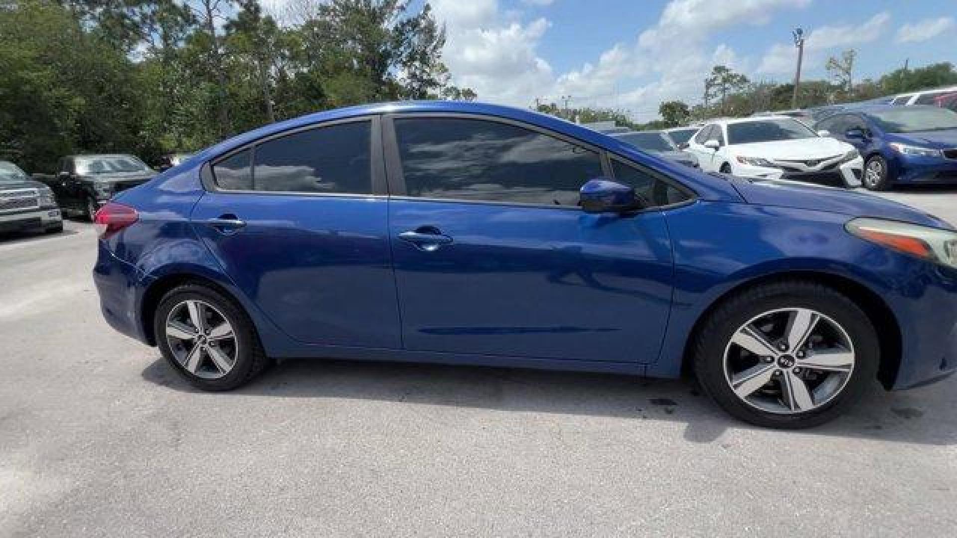 2018 Deep Sea Blue /Black Kia Forte LX (3KPFL4A73JE) with an 4 2.0 L engine, Automatic transmission, located at 27610 S Dixie Hwy, Homestead, FL, 33032, (305) 749-2348, 25.510241, -80.438301 - Delivers 37 Highway MPG and 29 City MPG! This Kia Forte delivers a Regular Unleaded I-4 2.0 L/122 engine powering this Automatic transmission. LX POPULAR PACKAGE -inc: covered console w/dual 12v outlet and drive mode select, Auto-On/Off Headlights, Dual Illuminated Visor Vanity Mirrors, Front Passen - Photo#5