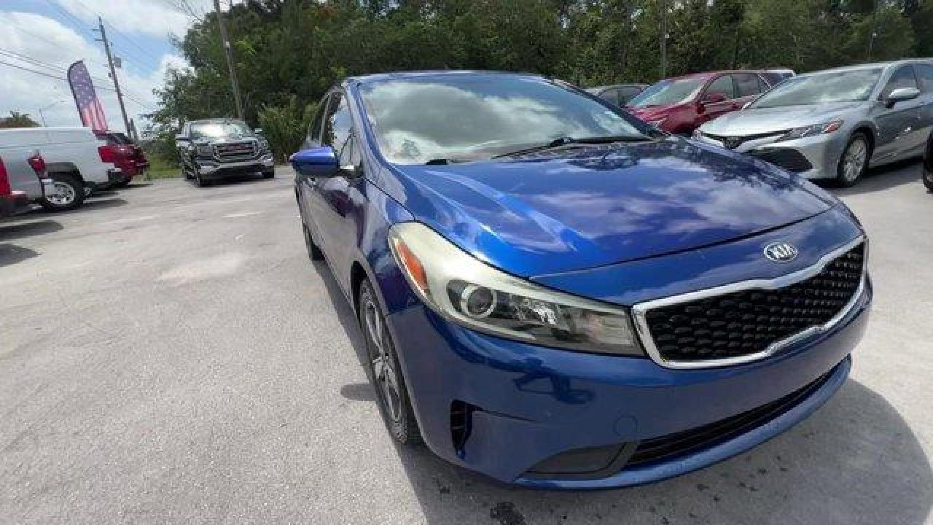 2018 Deep Sea Blue /Black Kia Forte LX (3KPFL4A73JE) with an 4 2.0 L engine, Automatic transmission, located at 27610 S Dixie Hwy, Homestead, FL, 33032, (305) 749-2348, 25.510241, -80.438301 - Delivers 37 Highway MPG and 29 City MPG! This Kia Forte delivers a Regular Unleaded I-4 2.0 L/122 engine powering this Automatic transmission. LX POPULAR PACKAGE -inc: covered console w/dual 12v outlet and drive mode select, Auto-On/Off Headlights, Dual Illuminated Visor Vanity Mirrors, Front Passen - Photo#7