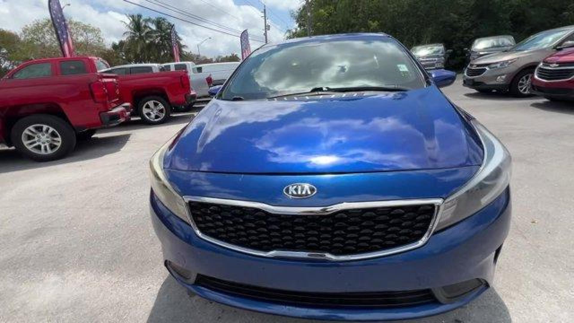 2018 Deep Sea Blue /Black Kia Forte LX (3KPFL4A73JE) with an 4 2.0 L engine, Automatic transmission, located at 27610 S Dixie Hwy, Homestead, FL, 33032, (305) 749-2348, 25.510241, -80.438301 - Delivers 37 Highway MPG and 29 City MPG! This Kia Forte delivers a Regular Unleaded I-4 2.0 L/122 engine powering this Automatic transmission. LX POPULAR PACKAGE -inc: covered console w/dual 12v outlet and drive mode select, Auto-On/Off Headlights, Dual Illuminated Visor Vanity Mirrors, Front Passen - Photo#7