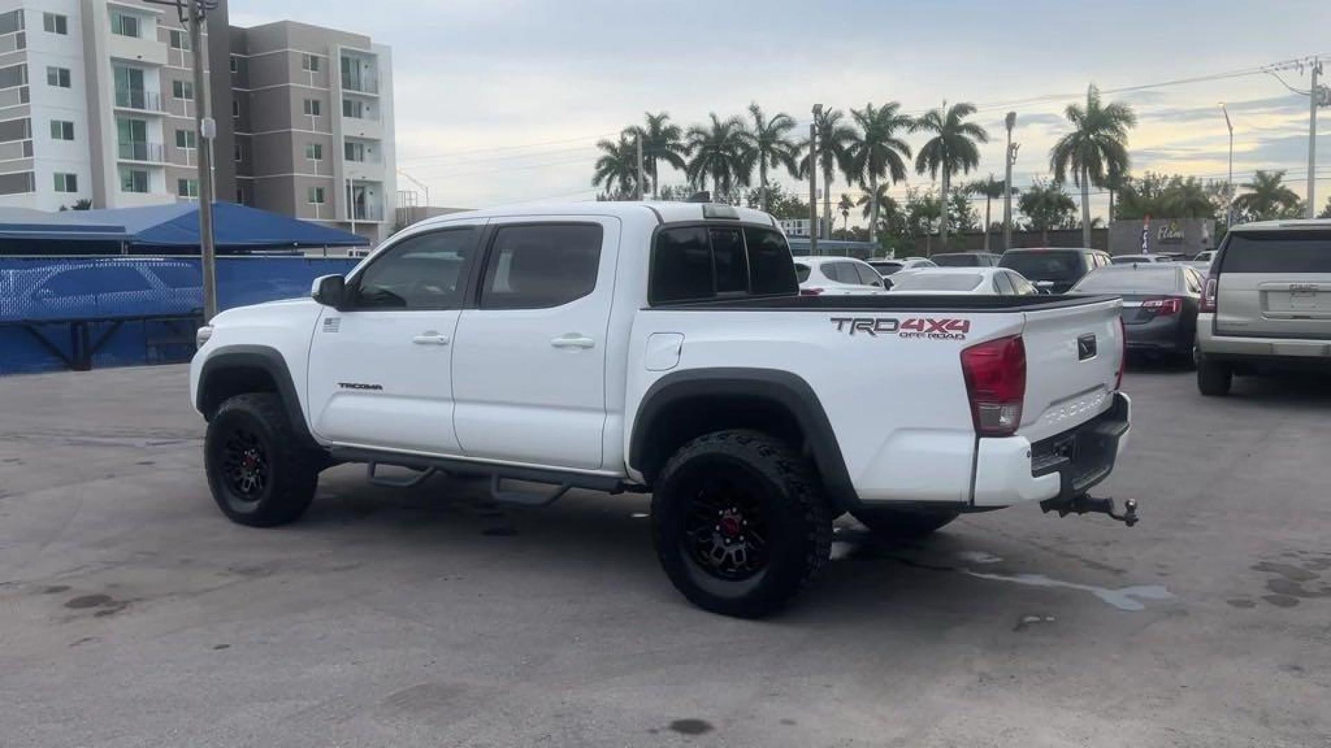 2016 Super White /Graphite Toyota Tacoma SR5 (5TFCZ5AN2GX) with an V6 engine, Automatic transmission, located at 27610 S Dixie Hwy, Homestead, FL, 33032, (305) 749-2348, 25.510241, -80.438301 - Photo#2