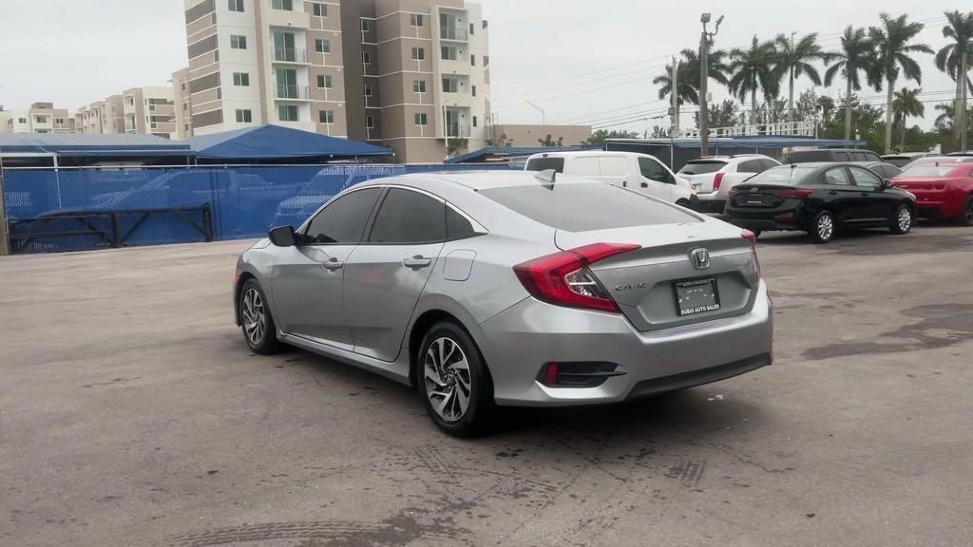 2018 Lunar Silver Metallic /Black Honda Civic EX (19XFC2F72JE) with an 2.0L I4 DOHC 16V i-VTEC engine, CVT transmission, located at 27610 S Dixie Hwy, Homestead, FL, 33032, (305) 749-2348, 25.510241, -80.438301 - Photo#2