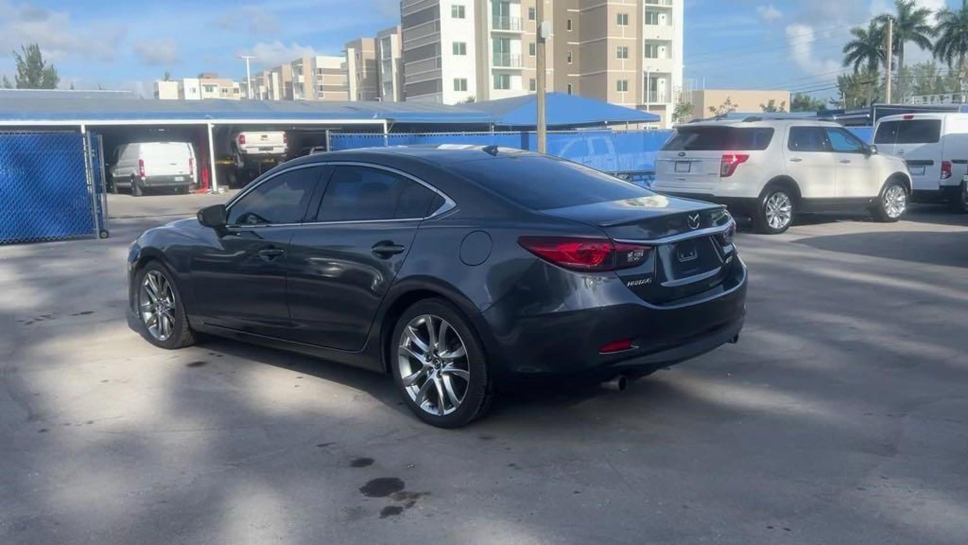 2014 Meteor Gray Mica Mazda Mazda6 i Grand Touring (JM1GJ1W55E1) with an SKYACTIV-G 2.5L I4 DOHC 16V engine, Automatic transmission, located at 27610 S Dixie Hwy, Homestead, FL, 33032, (305) 749-2348, 25.510241, -80.438301 - Photo#2