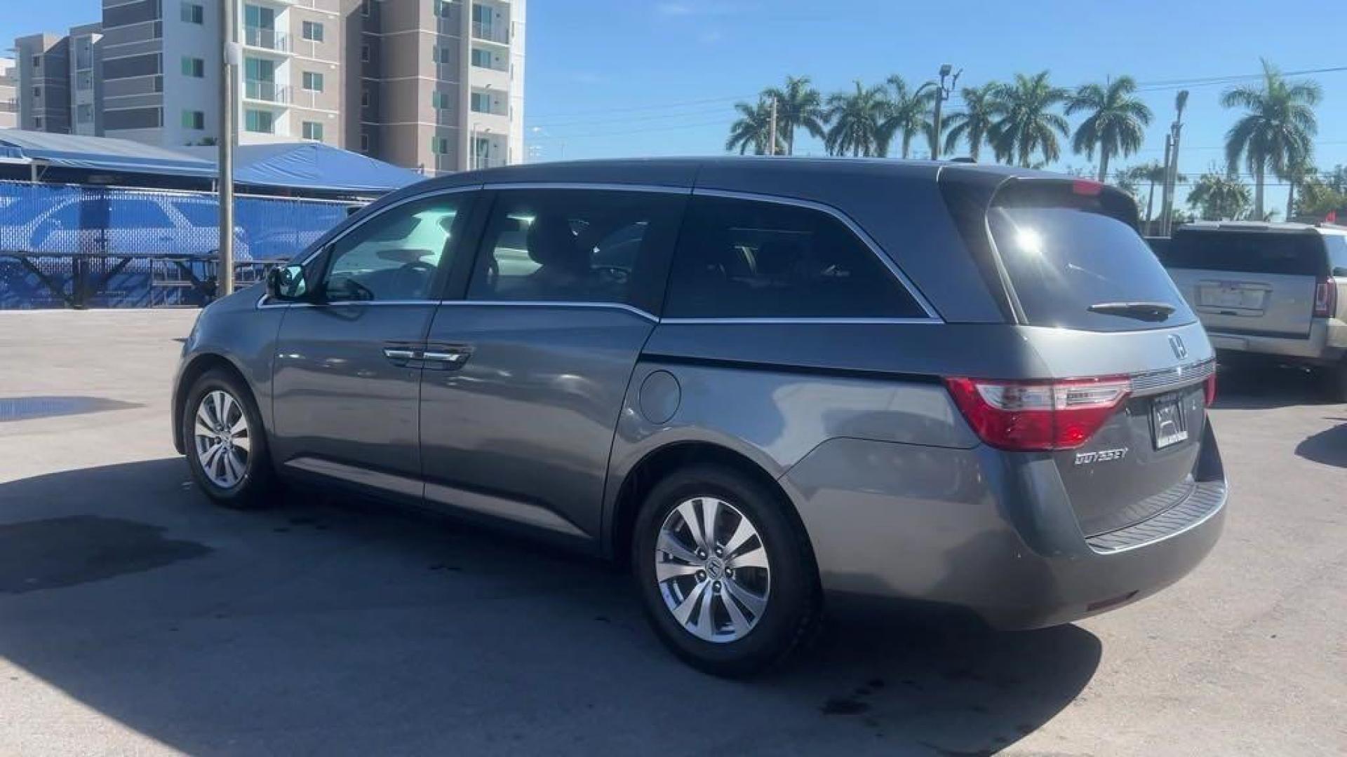 2011 Polished Metal Metallic /Gray Honda Odyssey EX-L (5FNRL5H66BB) with an 3.5L V6 engine, Automatic transmission, located at 27610 S Dixie Hwy, Homestead, FL, 33032, (305) 749-2348, 25.510241, -80.438301 - Photo#2