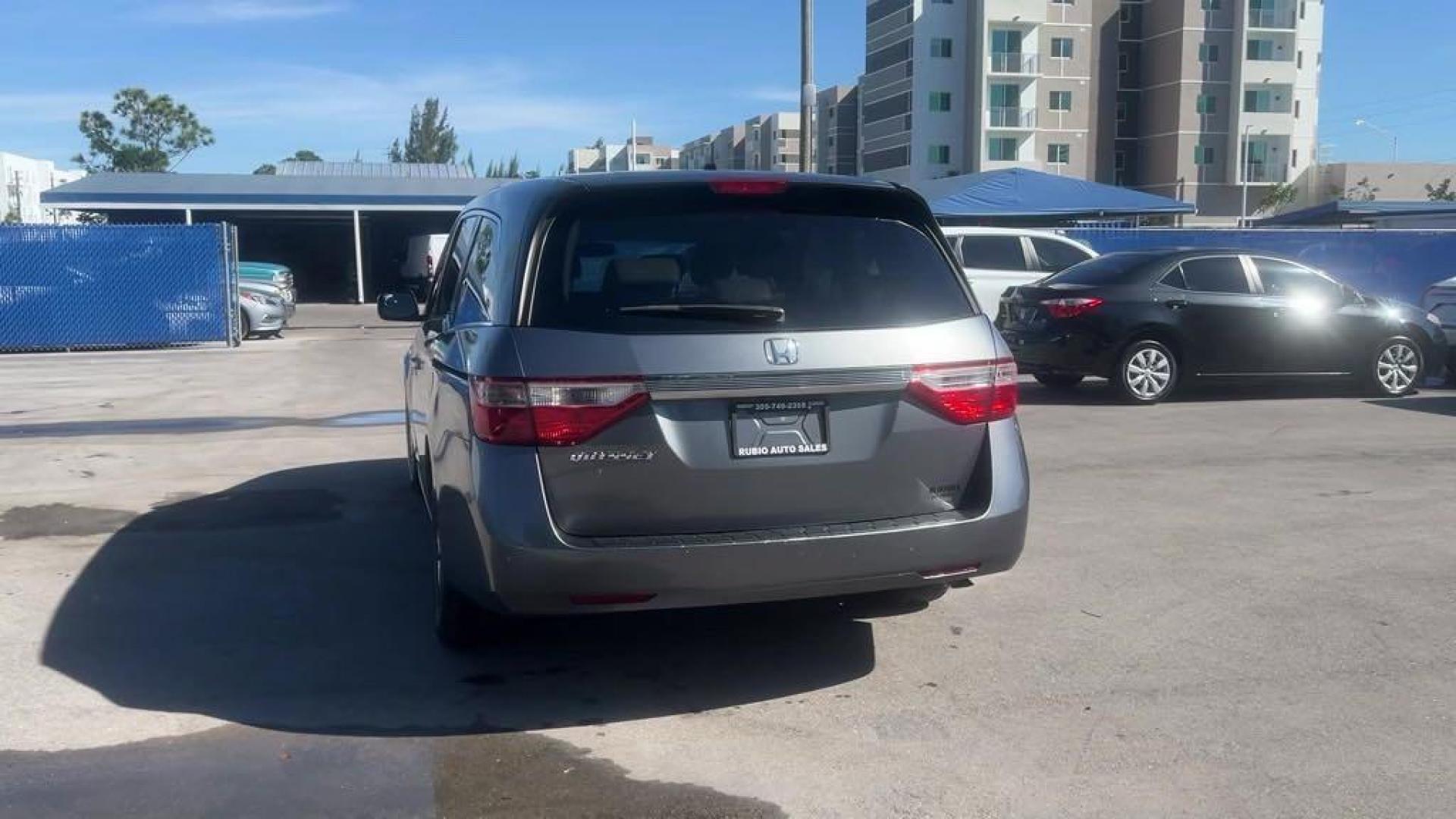 2011 Polished Metal Metallic /Gray Honda Odyssey EX-L (5FNRL5H66BB) with an 3.5L V6 engine, Automatic transmission, located at 27610 S Dixie Hwy, Homestead, FL, 33032, (305) 749-2348, 25.510241, -80.438301 - Photo#3