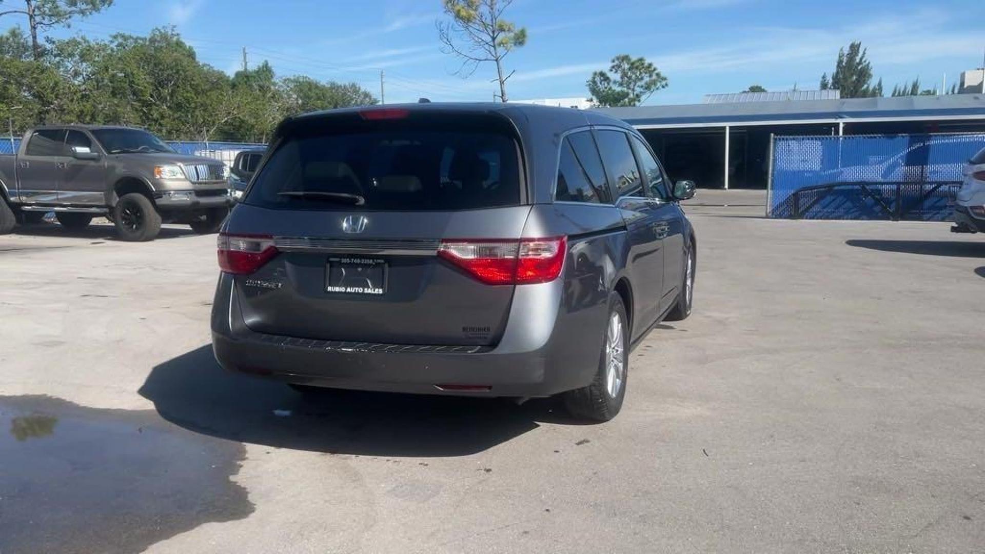 2011 Polished Metal Metallic /Gray Honda Odyssey EX-L (5FNRL5H66BB) with an 3.5L V6 engine, Automatic transmission, located at 27610 S Dixie Hwy, Homestead, FL, 33032, (305) 749-2348, 25.510241, -80.438301 - Photo#4