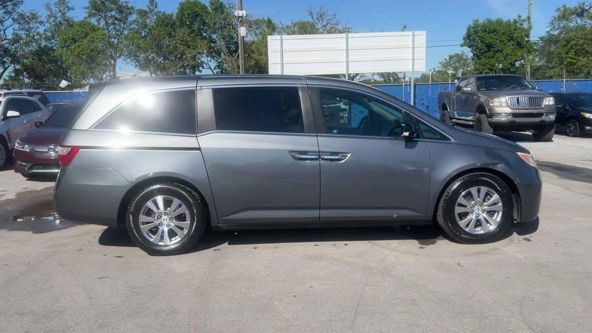 2011 Polished Metal Metallic /Gray Honda Odyssey EX-L (5FNRL5H66BB) with an 3.5L V6 engine, Automatic transmission, located at 27610 S Dixie Hwy, Homestead, FL, 33032, (305) 749-2348, 25.510241, -80.438301 - Photo#5
