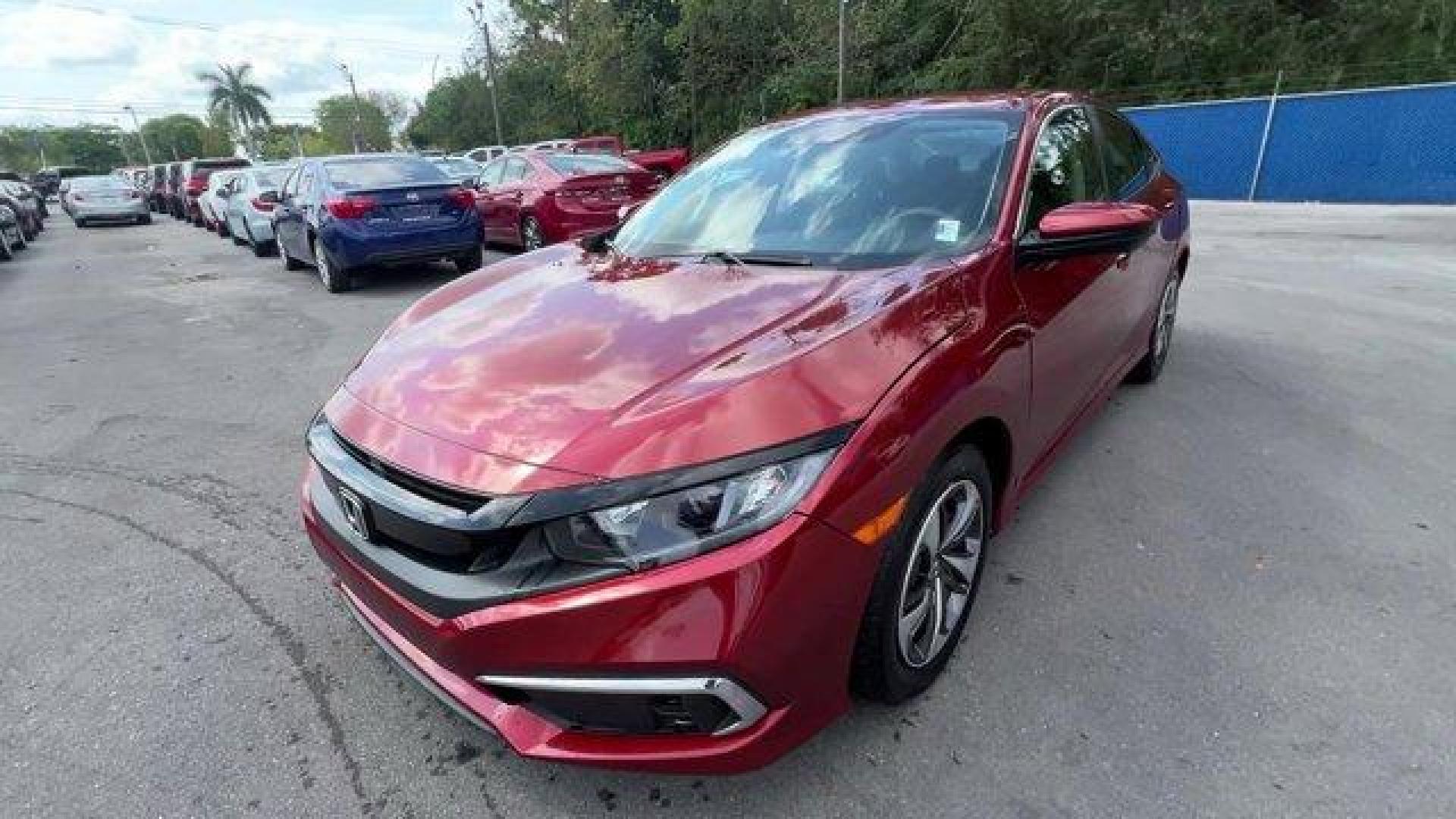2021 Red Honda Civic Sedan LX (2HGFC2F6XMH) with an 4 2.0 L engine, Variable transmission, located at 27610 S Dixie Hwy, Homestead, FL, 33032, (305) 749-2348, 25.510241, -80.438301 - Only 25,847 Miles! Scores 38 Highway MPG and 30 City MPG! This Honda Civic Sedan boasts a Regular Unleaded I-4 2.0 L/122 engine powering this Variable transmission. Window Grid Antenna, Wheels: 16 w/Full Covers, Vehicle Stability Assist (VSA) Electronic Stability Control (ESC).*This Honda Civic Seda - Photo#0