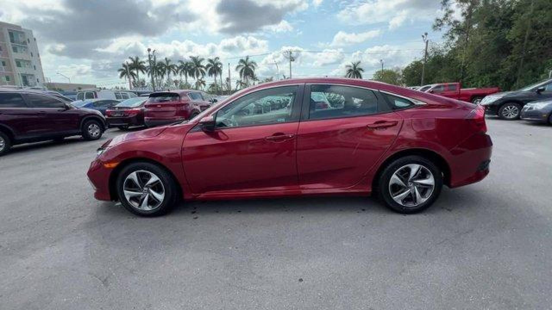 2021 Red Honda Civic Sedan LX (2HGFC2F6XMH) with an 4 2.0 L engine, Variable transmission, located at 27610 S Dixie Hwy, Homestead, FL, 33032, (305) 749-2348, 25.510241, -80.438301 - Only 25,847 Miles! Scores 38 Highway MPG and 30 City MPG! This Honda Civic Sedan boasts a Regular Unleaded I-4 2.0 L/122 engine powering this Variable transmission. Window Grid Antenna, Wheels: 16 w/Full Covers, Vehicle Stability Assist (VSA) Electronic Stability Control (ESC).*This Honda Civic Seda - Photo#1