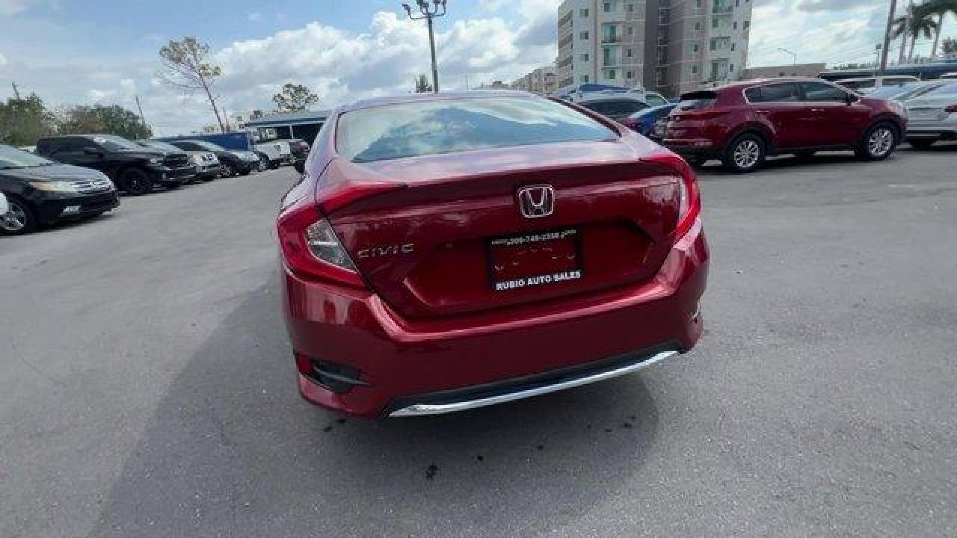 2021 Red Honda Civic Sedan LX (2HGFC2F6XMH) with an 4 2.0 L engine, Variable transmission, located at 27610 S Dixie Hwy, Homestead, FL, 33032, (305) 749-2348, 25.510241, -80.438301 - Only 25,847 Miles! Scores 38 Highway MPG and 30 City MPG! This Honda Civic Sedan boasts a Regular Unleaded I-4 2.0 L/122 engine powering this Variable transmission. Window Grid Antenna, Wheels: 16 w/Full Covers, Vehicle Stability Assist (VSA) Electronic Stability Control (ESC).*This Honda Civic Seda - Photo#3