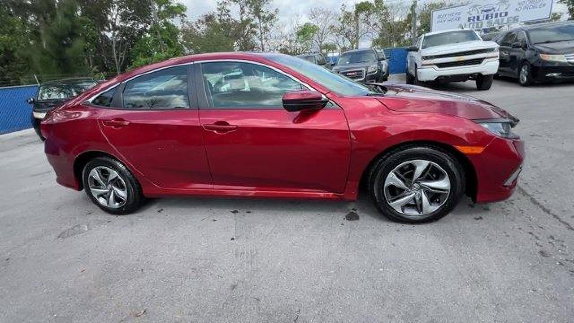 2021 Red Honda Civic Sedan LX (2HGFC2F6XMH) with an 4 2.0 L engine, Variable transmission, located at 27610 S Dixie Hwy, Homestead, FL, 33032, (305) 749-2348, 25.510241, -80.438301 - Only 25,847 Miles! Scores 38 Highway MPG and 30 City MPG! This Honda Civic Sedan boasts a Regular Unleaded I-4 2.0 L/122 engine powering this Variable transmission. Window Grid Antenna, Wheels: 16 w/Full Covers, Vehicle Stability Assist (VSA) Electronic Stability Control (ESC).*This Honda Civic Seda - Photo#5