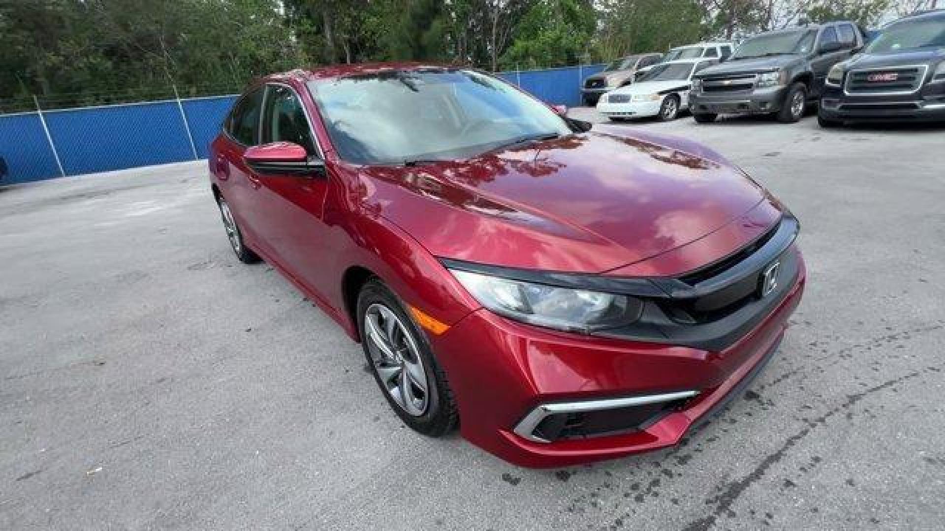 2021 Red Honda Civic Sedan LX (2HGFC2F6XMH) with an 4 2.0 L engine, Variable transmission, located at 27610 S Dixie Hwy, Homestead, FL, 33032, (305) 749-2348, 25.510241, -80.438301 - Only 25,847 Miles! Scores 38 Highway MPG and 30 City MPG! This Honda Civic Sedan boasts a Regular Unleaded I-4 2.0 L/122 engine powering this Variable transmission. Window Grid Antenna, Wheels: 16 w/Full Covers, Vehicle Stability Assist (VSA) Electronic Stability Control (ESC).*This Honda Civic Seda - Photo#6