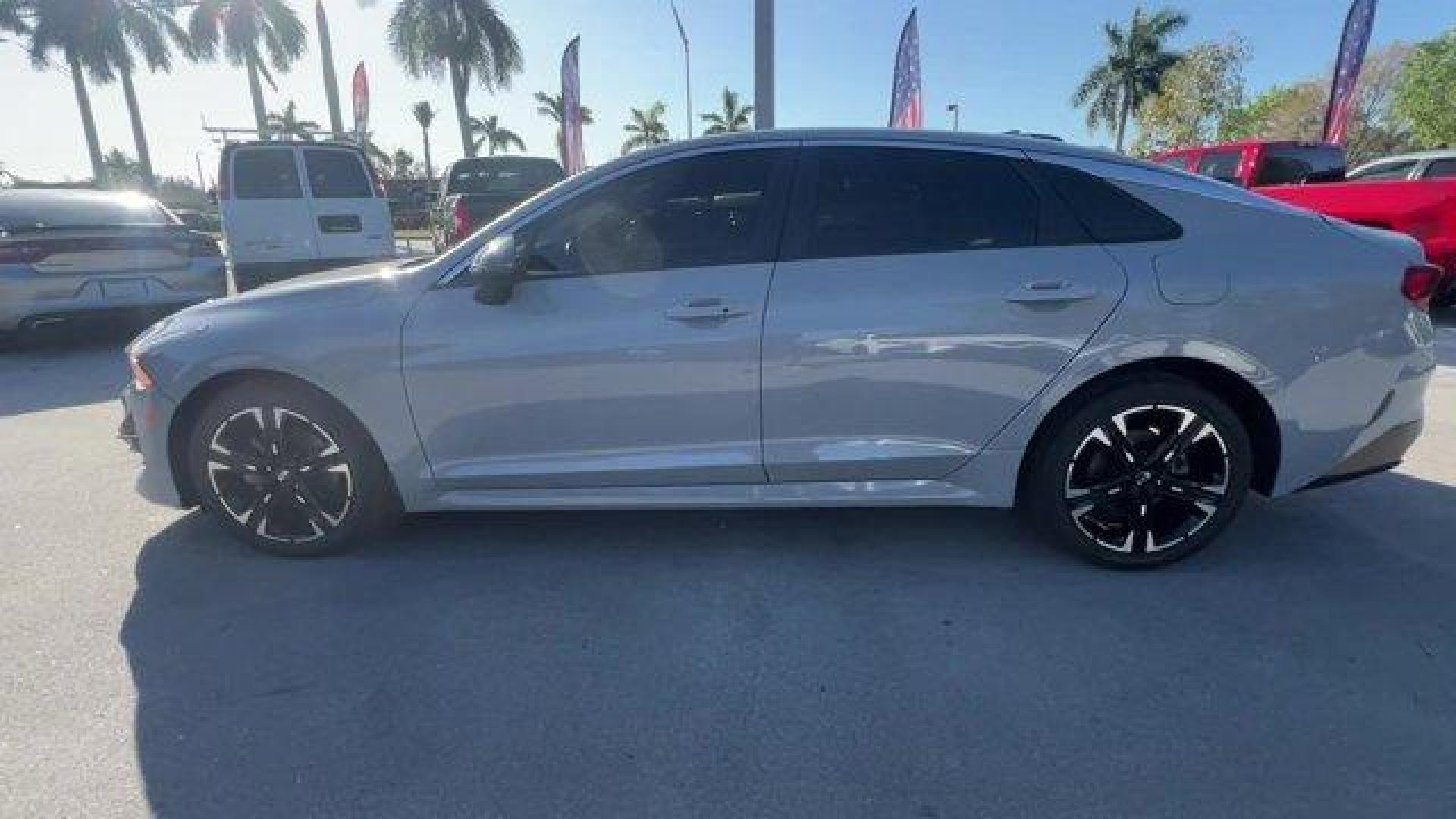 2021 Wolf Gray /Black Kia K5 GT-Line (5XXG64J24MG) with an 4 1.6 L engine, Automatic transmission, located at 27610 S Dixie Hwy, Homestead, FL, 33032, (305) 749-2348, 25.510241, -80.438301 - Only 35,083 Miles! Boasts 37 Highway MPG and 27 City MPG! This Kia K5 delivers a Intercooled Turbo Regular Unleaded I-4 1.6 L/98 engine powering this Automatic transmission. WOLF GRAY, GT-LINE RED INTERIOR PACKAGE, CARPETED FLOOR MATS.*This Kia K5 Comes Equipped with These Options *Window Grid Anten - Photo#1
