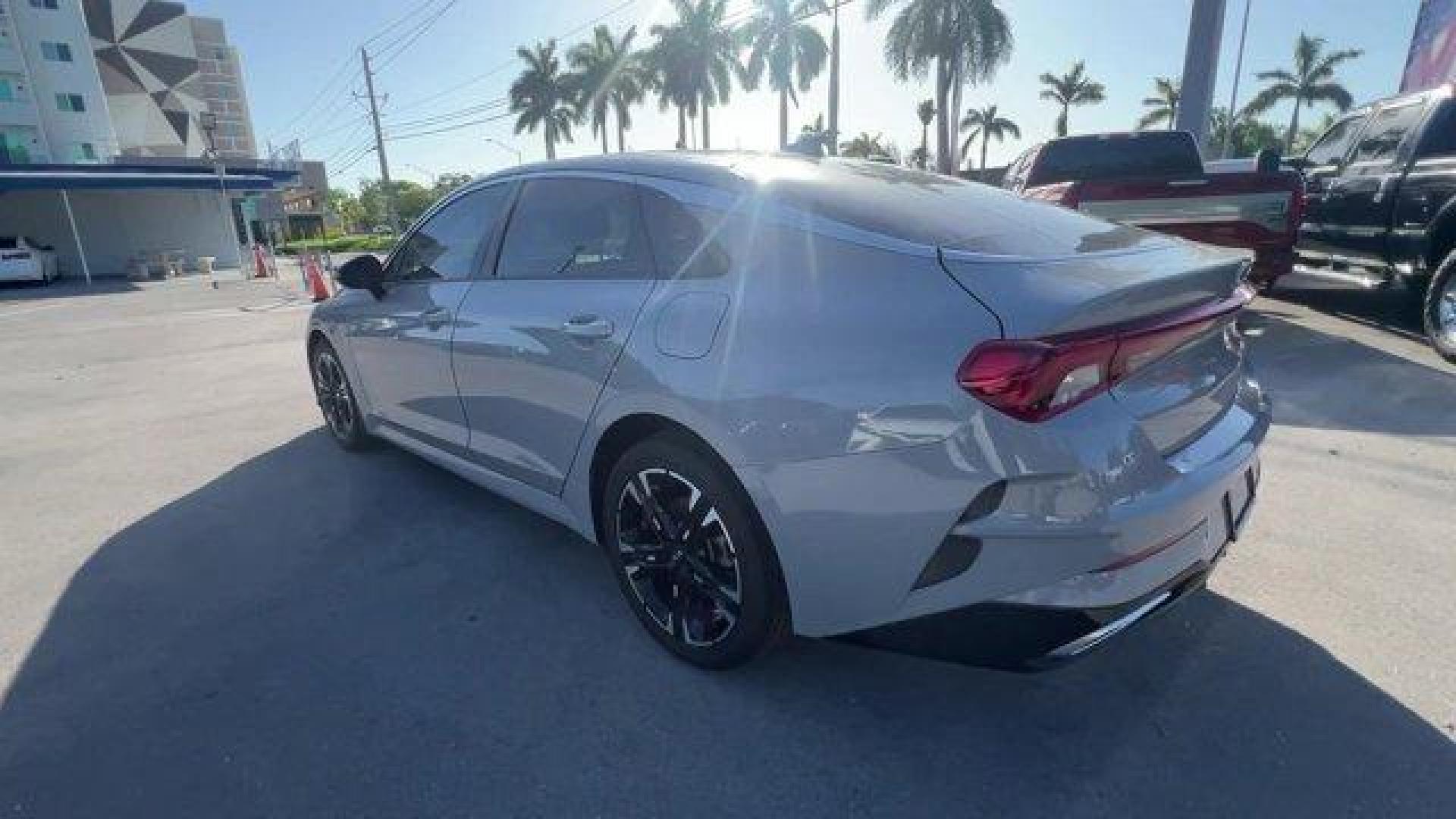 2021 Wolf Gray /Black Kia K5 GT-Line (5XXG64J24MG) with an 4 1.6 L engine, Automatic transmission, located at 27610 S Dixie Hwy, Homestead, FL, 33032, (305) 749-2348, 25.510241, -80.438301 - Only 35,083 Miles! Boasts 37 Highway MPG and 27 City MPG! This Kia K5 delivers a Intercooled Turbo Regular Unleaded I-4 1.6 L/98 engine powering this Automatic transmission. WOLF GRAY, GT-LINE RED INTERIOR PACKAGE, CARPETED FLOOR MATS.*This Kia K5 Comes Equipped with These Options *Window Grid Anten - Photo#2