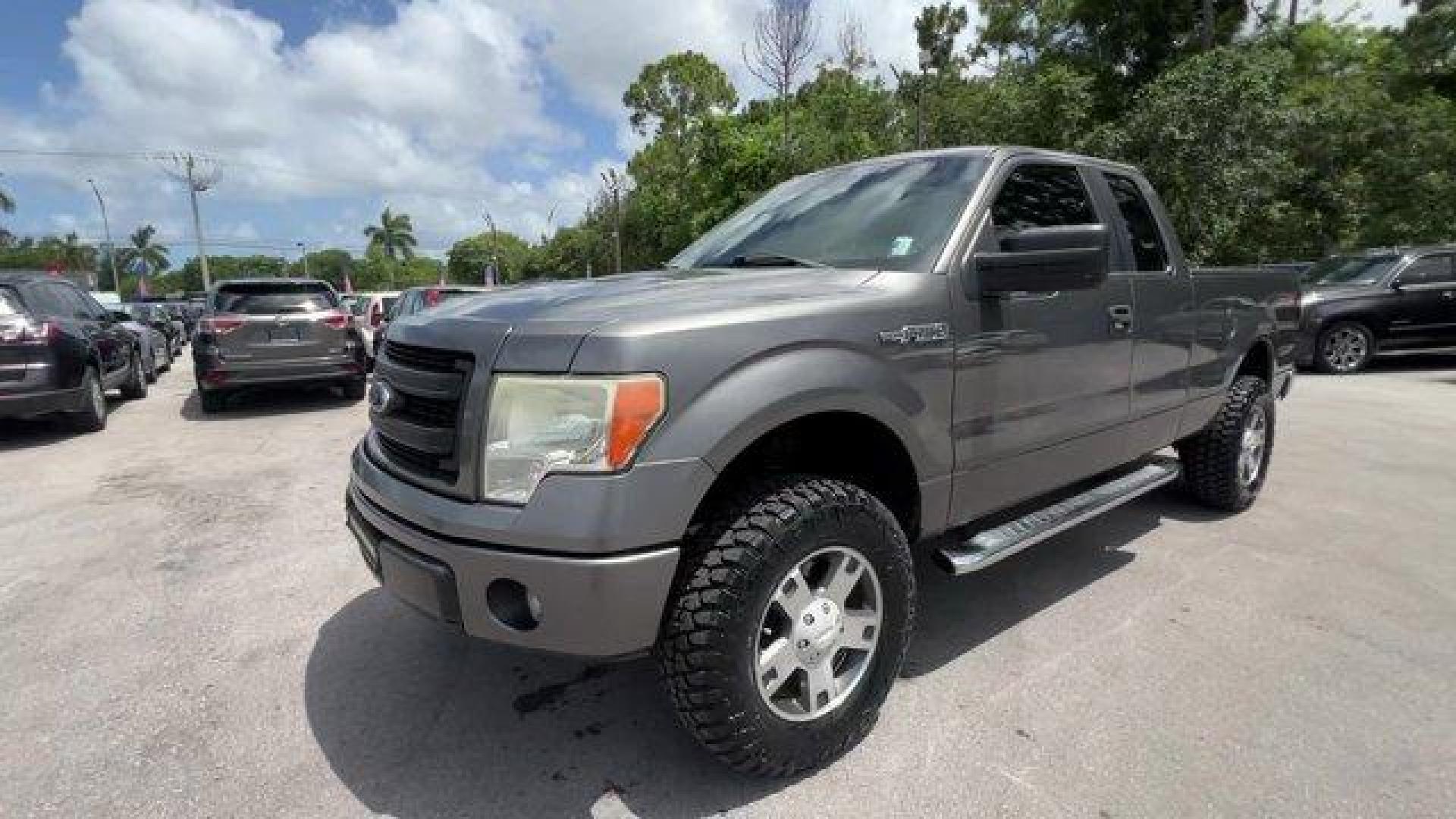 2013 Gray Ford F-150 (1FTEX1CM2DF) with an 6 3.7L engine, Automatic transmission, located at 27610 S Dixie Hwy, Homestead, FL, 33032, (305) 749-2348, 25.510241, -80.438301 - KBB.com Brand Image Awards. Boasts 23 Highway MPG and 17 City MPG! This Ford F-150 boasts a Gas/Ethanol V6 3.7L/227 engine powering this Automatic transmission. Variable interval wipers, Under frame winch-type spare tire carrier w/safety catch and lock, Trailer sway control.* This Ford F-150 Featu - Photo#0
