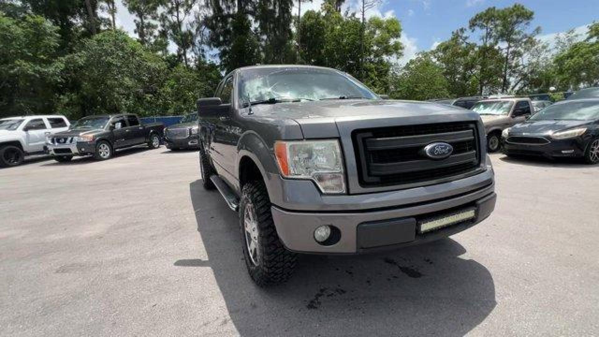 2013 Gray Ford F-150 (1FTEX1CM2DF) with an 6 3.7L engine, Automatic transmission, located at 27610 S Dixie Hwy, Homestead, FL, 33032, (305) 749-2348, 25.510241, -80.438301 - KBB.com Brand Image Awards. Boasts 23 Highway MPG and 17 City MPG! This Ford F-150 boasts a Gas/Ethanol V6 3.7L/227 engine powering this Automatic transmission. Variable interval wipers, Under frame winch-type spare tire carrier w/safety catch and lock, Trailer sway control.* This Ford F-150 Featu - Photo#6