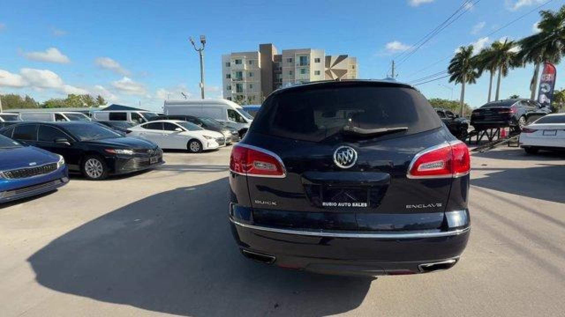 2015 Dark Sapphire Blue Metallic /Choccachino Buick Enclave Premium Group (5GAKRCKD3FJ) with an 6 3.6L engine, Automatic transmission, located at 27610 S Dixie Hwy, Homestead, FL, 33032, (305) 749-2348, 25.510241, -80.438301 - KBB.com 5-Year Cost to Own Awards. Scores 24 Highway MPG and 17 City MPG! This Buick Enclave delivers a Gas V6 3.6L/217 engine powering this Automatic transmission. WHEELS, 20 (50.8 CM) ULTRA BRIGHT BLADE SILVER MACHINED PAINTED ALUMINUM, TRANSMISSION, 6- SPEED AUTOMATIC, ELECTRONICALLY CONTROLLED W - Photo#2