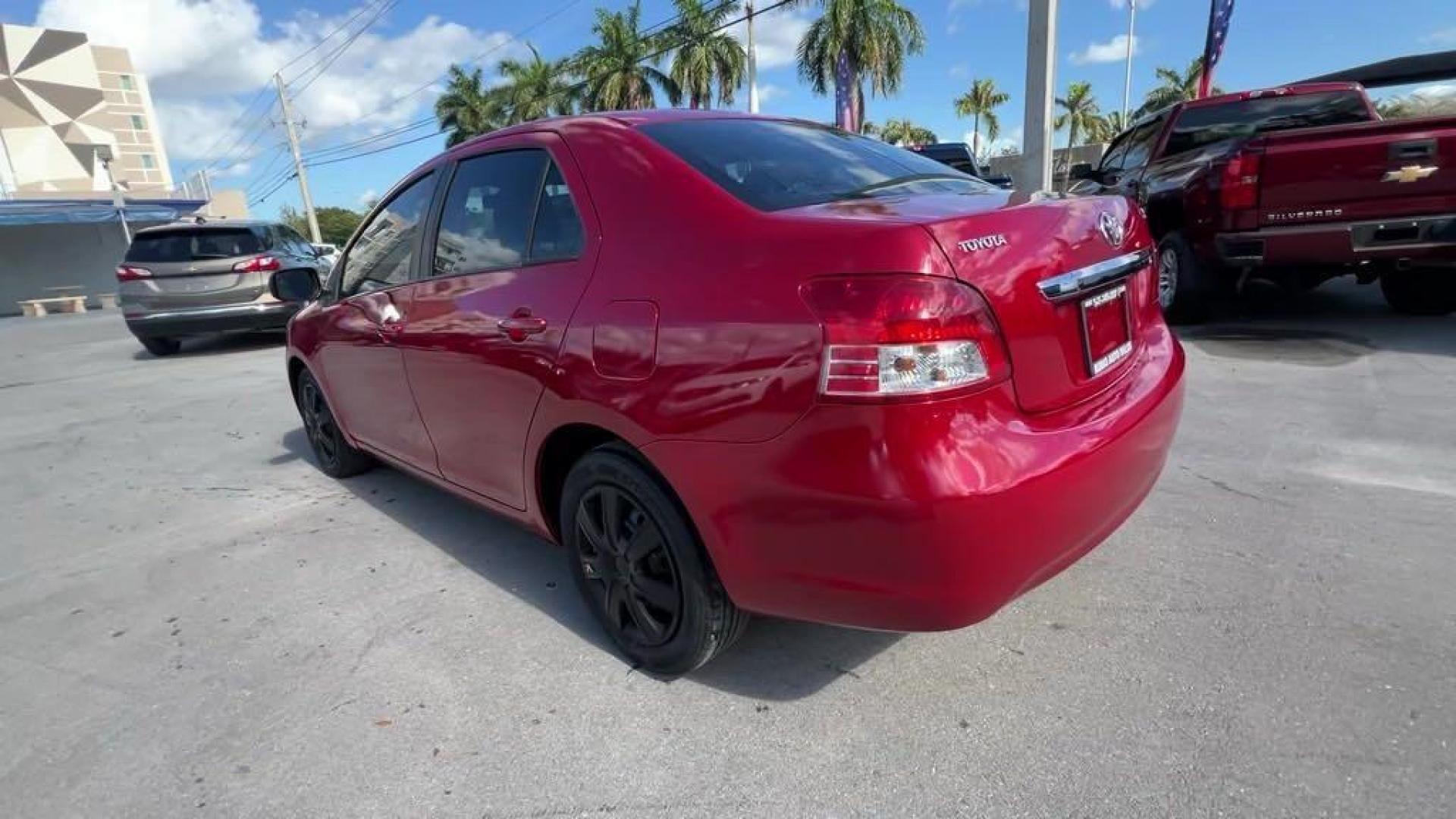 2011 Barcelona Red Metallic Toyota Yaris Base (JTDBT4K37B1) with an 1.5L I4 DOHC VVT-i 16V engine, Automatic transmission, located at 27610 S Dixie Hwy, Homestead, FL, 33032, (305) 749-2348, 25.510241, -80.438301 - Photo#2