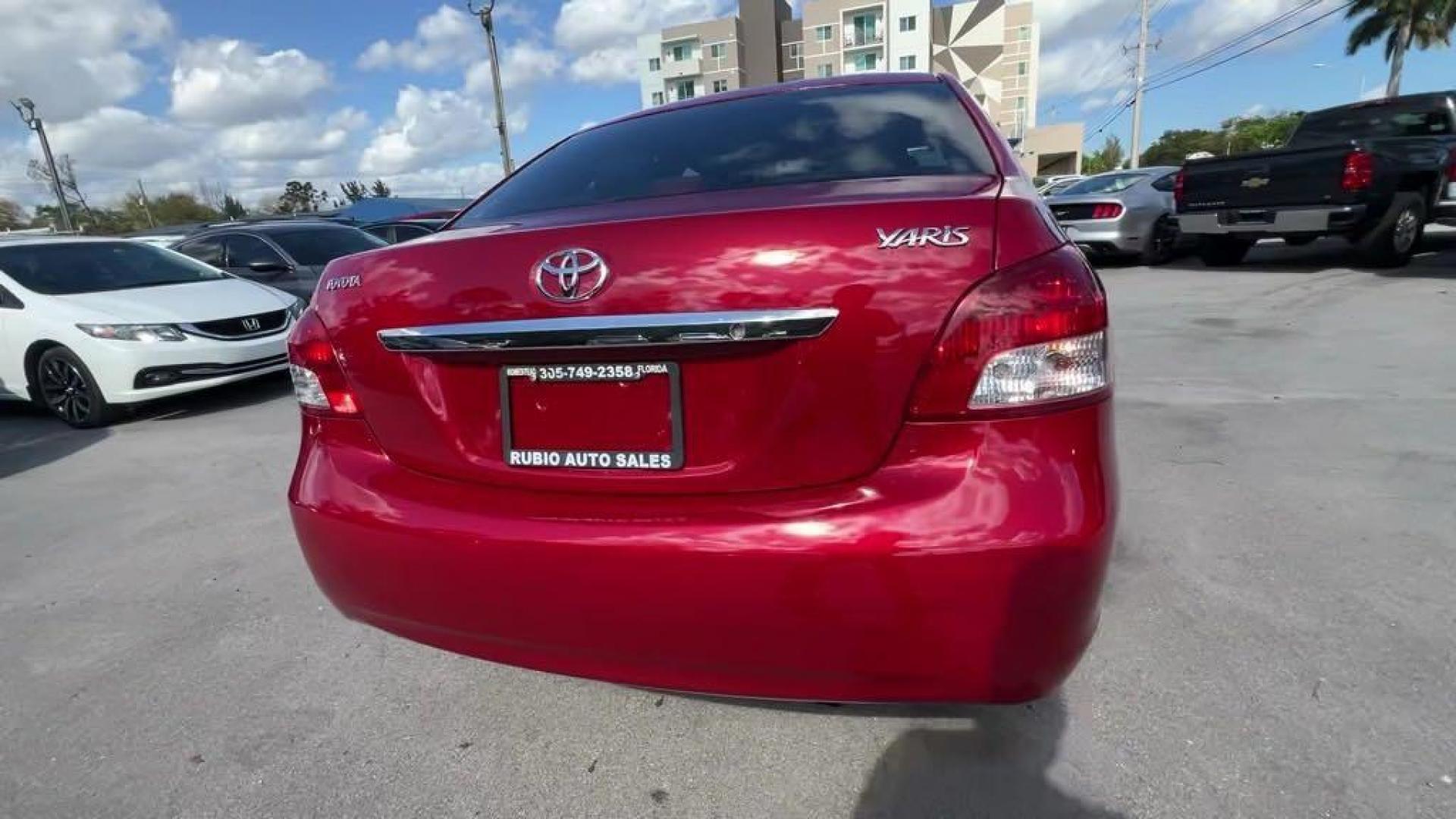 2011 Barcelona Red Metallic Toyota Yaris Base (JTDBT4K37B1) with an 1.5L I4 DOHC VVT-i 16V engine, Automatic transmission, located at 27610 S Dixie Hwy, Homestead, FL, 33032, (305) 749-2348, 25.510241, -80.438301 - Photo#3