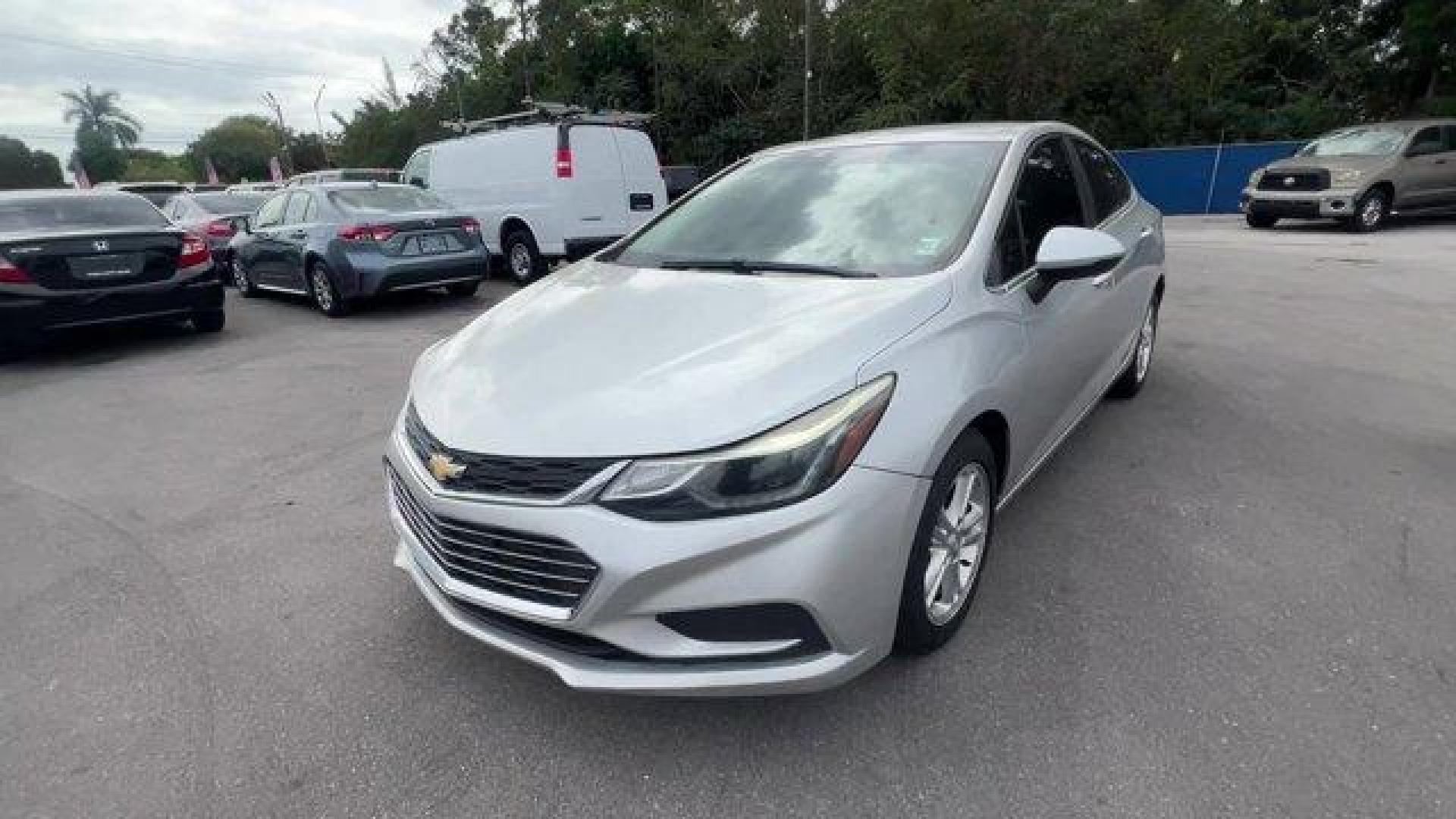 2018 Silver Ice Metallic /Jet Black Chevrolet Cruze LT (1G1BE5SM3J7) with an 4 1.4L engine, Automatic transmission, located at 27610 S Dixie Hwy, Homestead, FL, 33032, (305) 749-2348, 25.510241, -80.438301 - KBB.com 10 Most Awarded Brands. Delivers 40 Highway MPG and 29 City MPG! This Chevrolet Cruze delivers a Turbocharged Gas I4 1.4L/ engine powering this Automatic transmission. WHEELS, 16 (40.6 CM) ALUMINUM (STD), TRANSMISSION, 6-SPEED AUTOMATIC (STD), TIRES, 205/55R16 ALL-SEASON, BLACKWALL.* This Ch - Photo#0