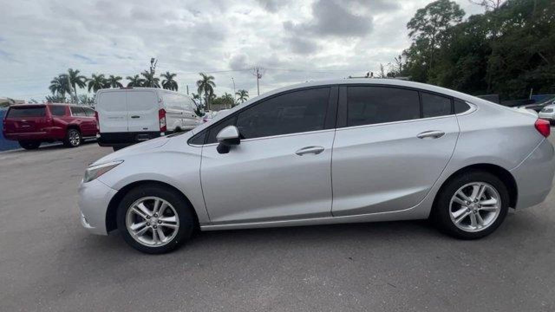 2018 Silver Ice Metallic /Jet Black Chevrolet Cruze LT (1G1BE5SM3J7) with an 4 1.4L engine, Automatic transmission, located at 27610 S Dixie Hwy, Homestead, FL, 33032, (305) 749-2348, 25.510241, -80.438301 - KBB.com 10 Most Awarded Brands. Delivers 40 Highway MPG and 29 City MPG! This Chevrolet Cruze delivers a Turbocharged Gas I4 1.4L/ engine powering this Automatic transmission. WHEELS, 16 (40.6 CM) ALUMINUM (STD), TRANSMISSION, 6-SPEED AUTOMATIC (STD), TIRES, 205/55R16 ALL-SEASON, BLACKWALL.* This Ch - Photo#1