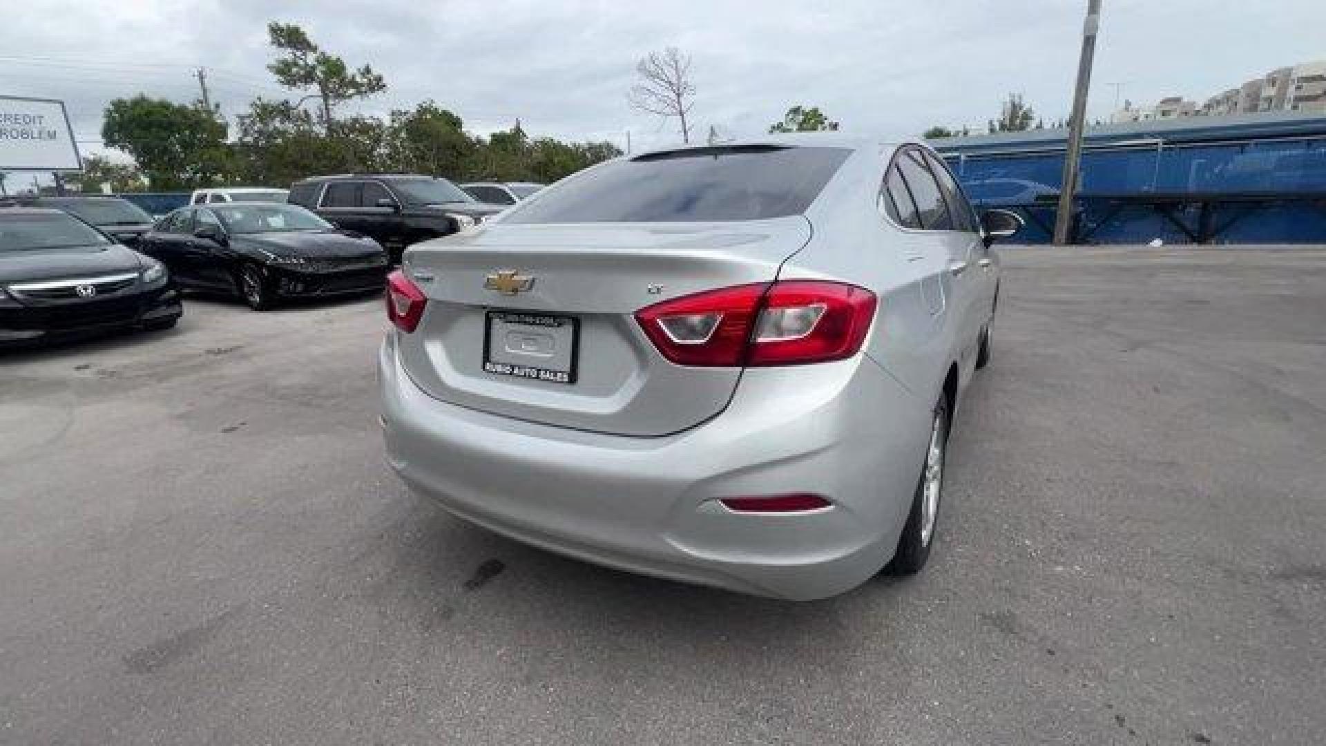 2018 Silver Ice Metallic /Jet Black Chevrolet Cruze LT (1G1BE5SM3J7) with an 4 1.4L engine, Automatic transmission, located at 27610 S Dixie Hwy, Homestead, FL, 33032, (305) 749-2348, 25.510241, -80.438301 - KBB.com 10 Most Awarded Brands. Delivers 40 Highway MPG and 29 City MPG! This Chevrolet Cruze delivers a Turbocharged Gas I4 1.4L/ engine powering this Automatic transmission. WHEELS, 16 (40.6 CM) ALUMINUM (STD), TRANSMISSION, 6-SPEED AUTOMATIC (STD), TIRES, 205/55R16 ALL-SEASON, BLACKWALL.* This Ch - Photo#4