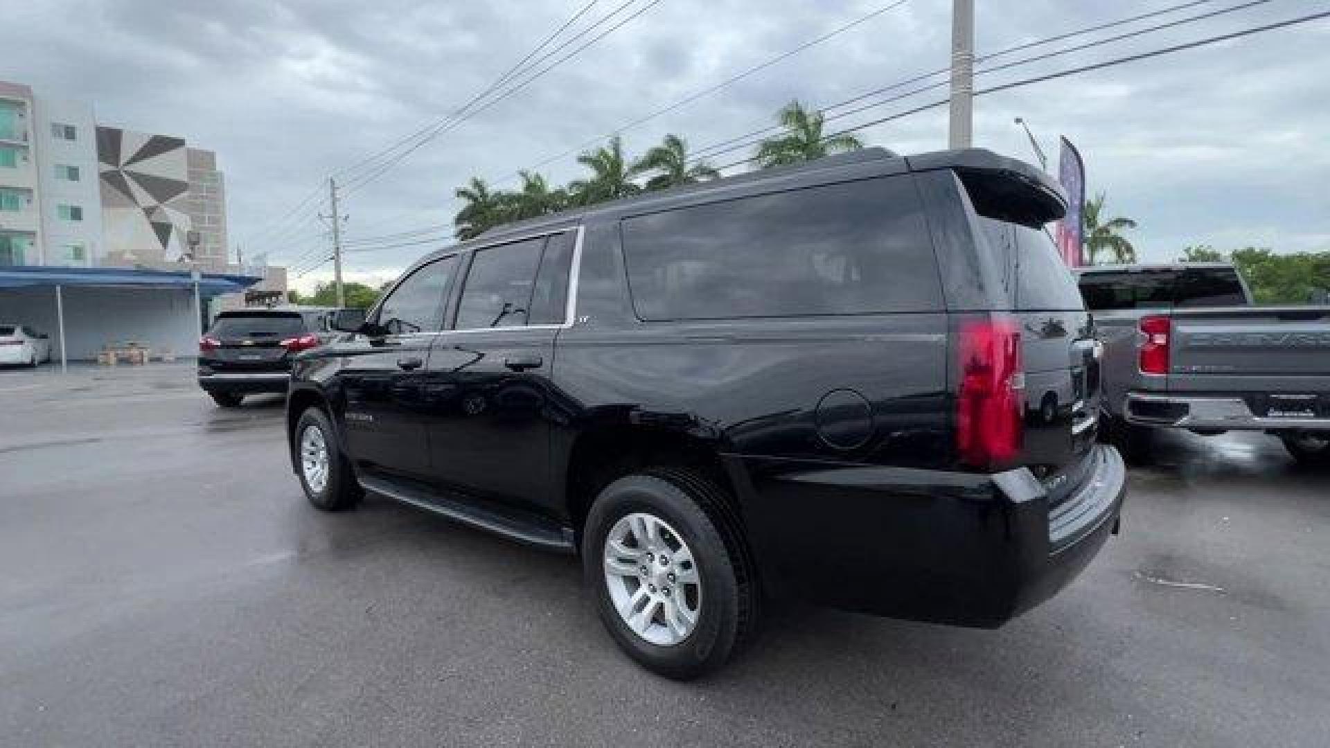 2019 Black /Jet Black/Dark Ash Chevrolet Suburban LT (1GNSCHKC5KR) with an 8 5.3L engine, Automatic transmission, located at 27610 S Dixie Hwy, Homestead, FL, 33032, (305) 749-2348, 25.510241, -80.438301 - Delivers 22 Highway MPG and 15 City MPG! This Chevrolet Suburban delivers a Gas/Ethanol V8 5.3L/ engine powering this Automatic transmission. WHEELS, 18 X 8.5 (45.7 CM X 21.6 CM) ALUMINUM WITH HIGH-POLISHED FINISH (STD), TRANSMISSION, 6-SPEED AUTOMATIC, ELECTRONICALLY CONTROLLED with overdrive and t - Photo#2