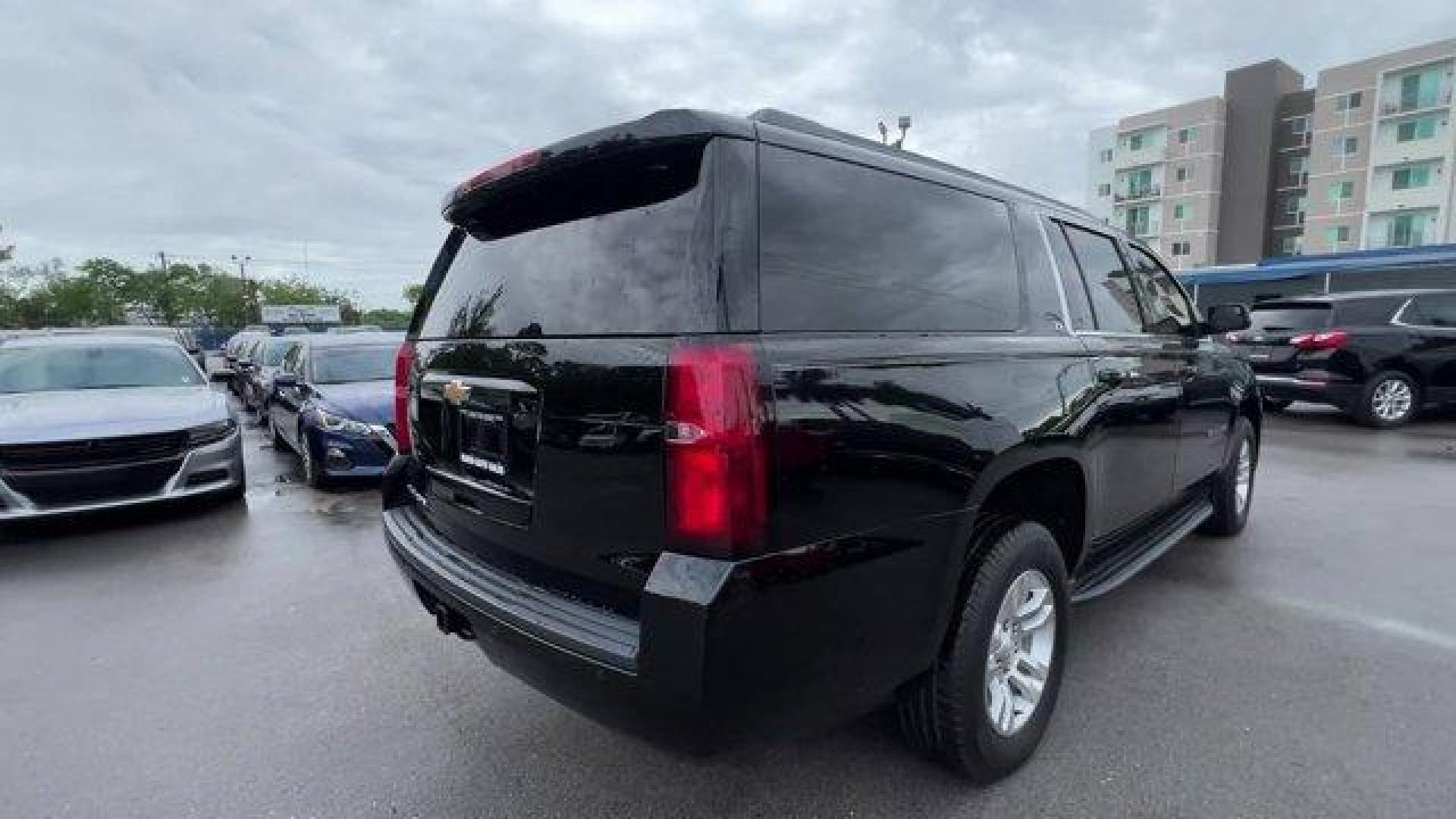 2019 Black /Jet Black/Dark Ash Chevrolet Suburban LT (1GNSCHKC5KR) with an 8 5.3L engine, Automatic transmission, located at 27610 S Dixie Hwy, Homestead, FL, 33032, (305) 749-2348, 25.510241, -80.438301 - Delivers 22 Highway MPG and 15 City MPG! This Chevrolet Suburban delivers a Gas/Ethanol V8 5.3L/ engine powering this Automatic transmission. WHEELS, 18 X 8.5 (45.7 CM X 21.6 CM) ALUMINUM WITH HIGH-POLISHED FINISH (STD), TRANSMISSION, 6-SPEED AUTOMATIC, ELECTRONICALLY CONTROLLED with overdrive and t - Photo#4