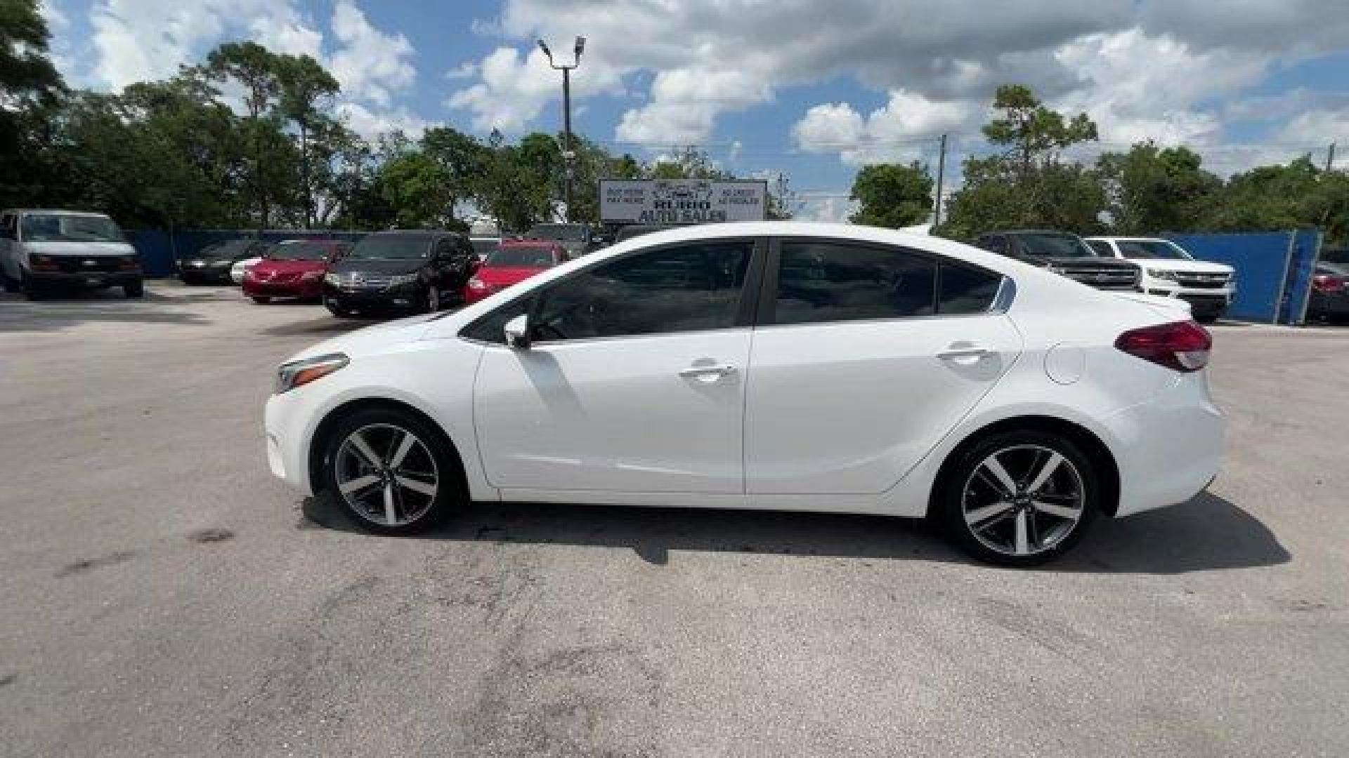 2017 Snow White Pearl /Black Kia Forte (3KPFL4A80HE) with an 4 2.0 L engine, Automatic transmission, located at 27610 S Dixie Hwy, Homestead, FL, 33032, (305) 749-2348, 25.510241, -80.438301 - KBB.com 10 Most Awarded Brands. Only 79,834 Miles! Scores 33 Highway MPG and 25 City MPG! This Kia Forte delivers a Regular Unleaded I-4 2.0 L/122 engine powering this Automatic transmission. SNOW WHITE PEARL, CARPETED FLOOR MATS, BLACK, LEATHER SEAT TRIM.*This Kia Forte Comes Equipped with These Op - Photo#1