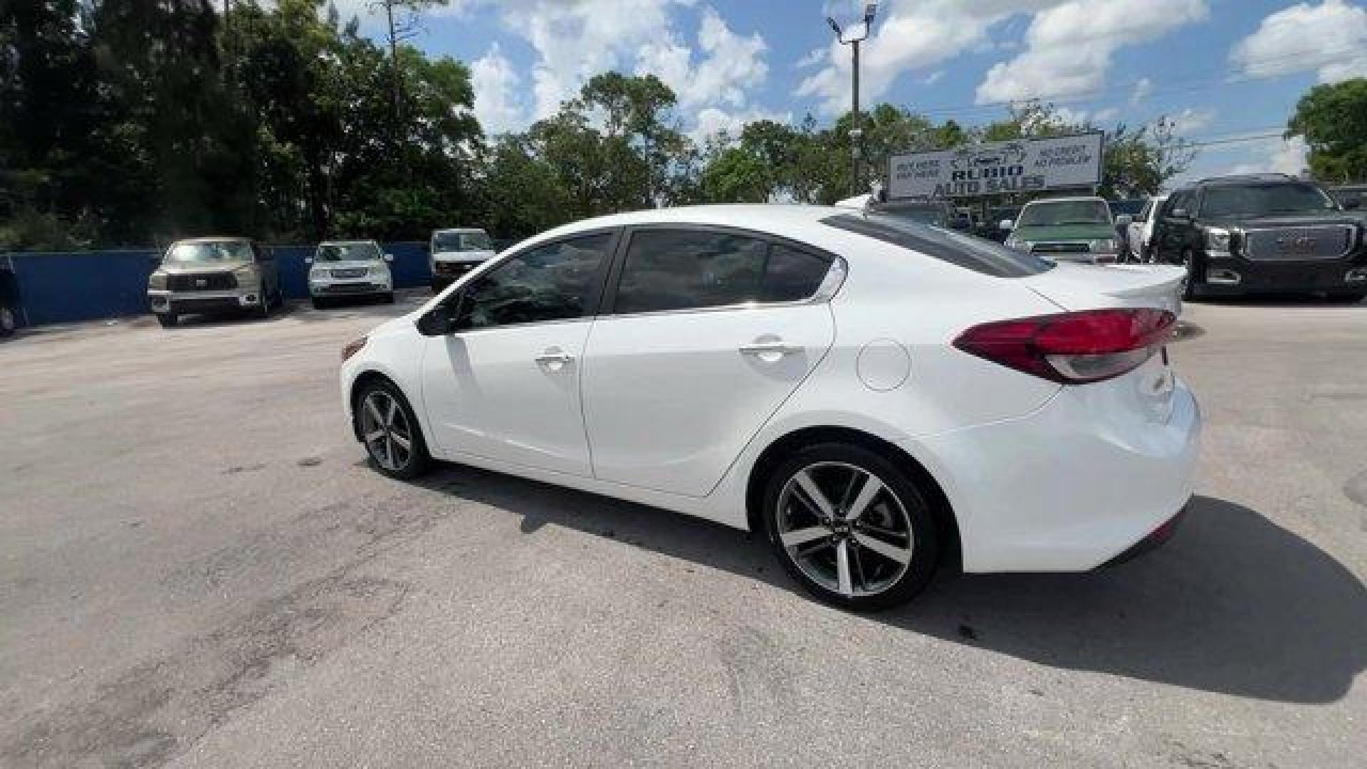 2017 Snow White Pearl /Black Kia Forte (3KPFL4A80HE) with an 4 2.0 L engine, Automatic transmission, located at 27610 S Dixie Hwy, Homestead, FL, 33032, (305) 749-2348, 25.510241, -80.438301 - KBB.com 10 Most Awarded Brands. Only 79,834 Miles! Scores 33 Highway MPG and 25 City MPG! This Kia Forte delivers a Regular Unleaded I-4 2.0 L/122 engine powering this Automatic transmission. SNOW WHITE PEARL, CARPETED FLOOR MATS, BLACK, LEATHER SEAT TRIM.*This Kia Forte Comes Equipped with These Op - Photo#2