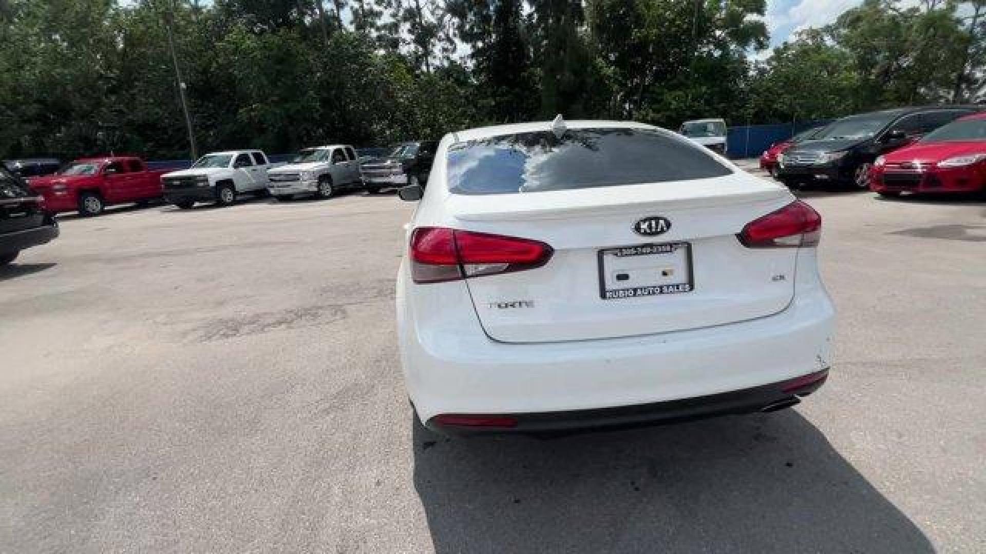 2017 Snow White Pearl /Black Kia Forte (3KPFL4A80HE) with an 4 2.0 L engine, Automatic transmission, located at 27610 S Dixie Hwy, Homestead, FL, 33032, (305) 749-2348, 25.510241, -80.438301 - KBB.com 10 Most Awarded Brands. Only 79,834 Miles! Scores 33 Highway MPG and 25 City MPG! This Kia Forte delivers a Regular Unleaded I-4 2.0 L/122 engine powering this Automatic transmission. SNOW WHITE PEARL, CARPETED FLOOR MATS, BLACK, LEATHER SEAT TRIM.*This Kia Forte Comes Equipped with These Op - Photo#3