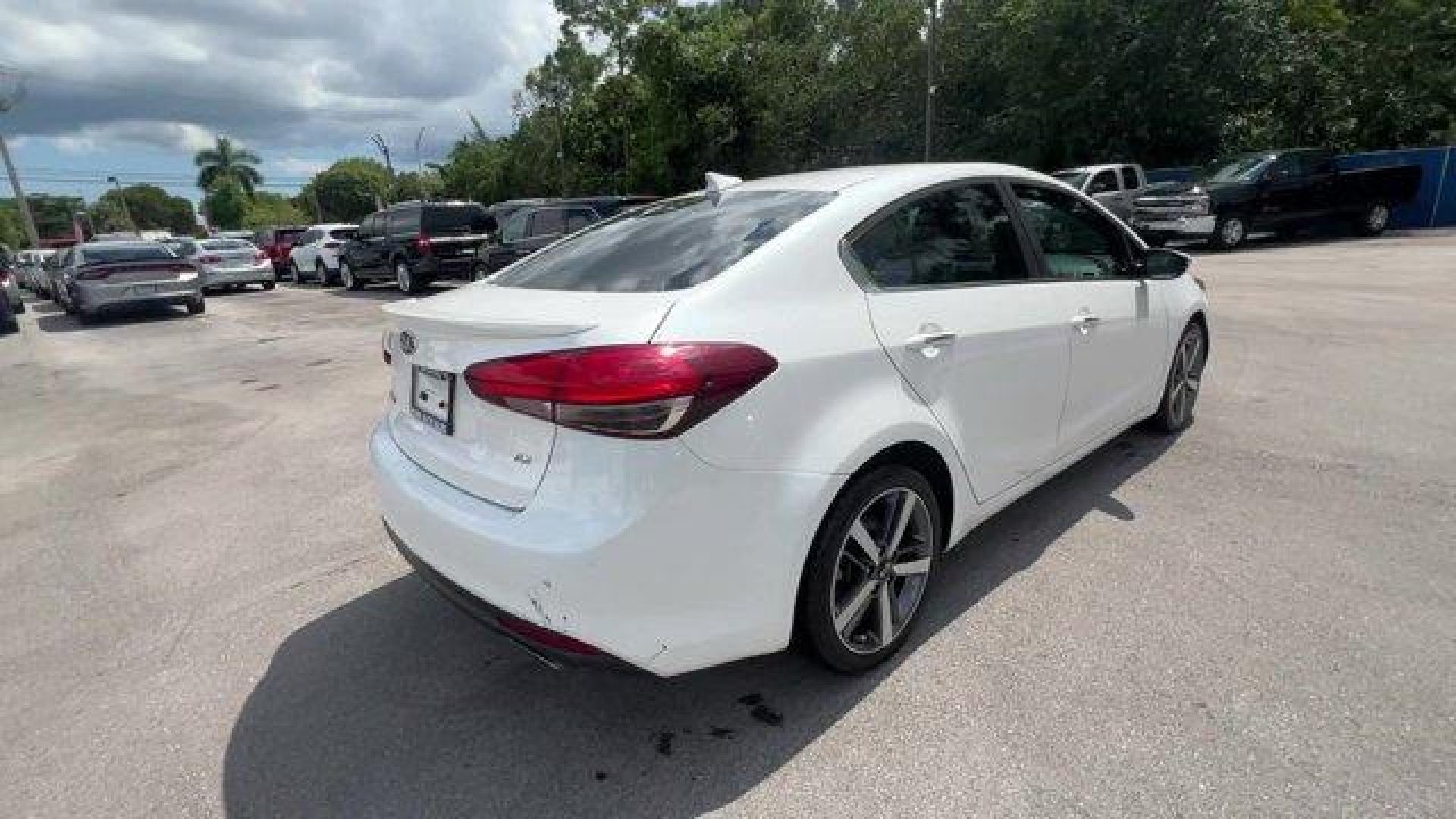 2017 Snow White Pearl /Black Kia Forte (3KPFL4A80HE) with an 4 2.0 L engine, Automatic transmission, located at 27610 S Dixie Hwy, Homestead, FL, 33032, (305) 749-2348, 25.510241, -80.438301 - KBB.com 10 Most Awarded Brands. Only 79,834 Miles! Scores 33 Highway MPG and 25 City MPG! This Kia Forte delivers a Regular Unleaded I-4 2.0 L/122 engine powering this Automatic transmission. SNOW WHITE PEARL, CARPETED FLOOR MATS, BLACK, LEATHER SEAT TRIM.*This Kia Forte Comes Equipped with These Op - Photo#4