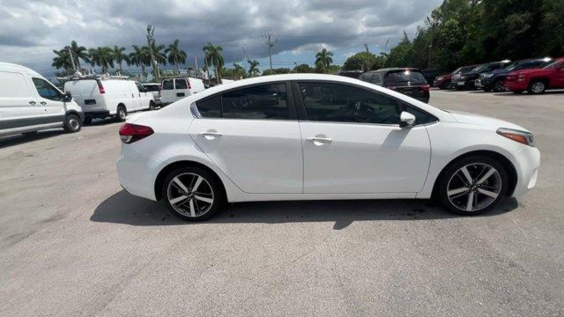 2017 Snow White Pearl /Black Kia Forte (3KPFL4A80HE) with an 4 2.0 L engine, Automatic transmission, located at 27610 S Dixie Hwy, Homestead, FL, 33032, (305) 749-2348, 25.510241, -80.438301 - KBB.com 10 Most Awarded Brands. Only 79,834 Miles! Scores 33 Highway MPG and 25 City MPG! This Kia Forte delivers a Regular Unleaded I-4 2.0 L/122 engine powering this Automatic transmission. SNOW WHITE PEARL, CARPETED FLOOR MATS, BLACK, LEATHER SEAT TRIM.*This Kia Forte Comes Equipped with These Op - Photo#5