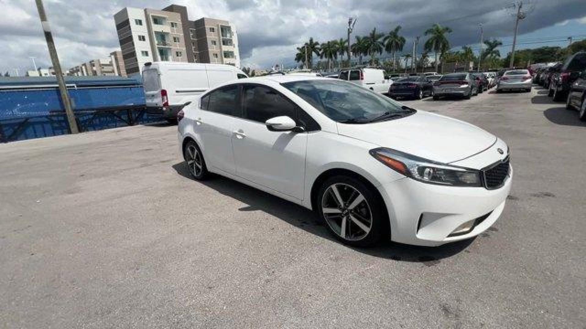 2017 Snow White Pearl /Black Kia Forte (3KPFL4A80HE) with an 4 2.0 L engine, Automatic transmission, located at 27610 S Dixie Hwy, Homestead, FL, 33032, (305) 749-2348, 25.510241, -80.438301 - KBB.com 10 Most Awarded Brands. Only 79,834 Miles! Scores 33 Highway MPG and 25 City MPG! This Kia Forte delivers a Regular Unleaded I-4 2.0 L/122 engine powering this Automatic transmission. SNOW WHITE PEARL, CARPETED FLOOR MATS, BLACK, LEATHER SEAT TRIM.*This Kia Forte Comes Equipped with These Op - Photo#6