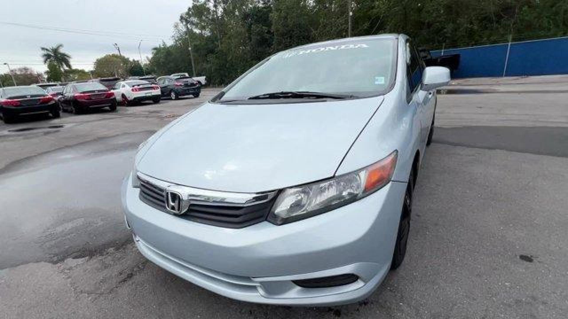 2012 Blue Honda Civic Sdn (19XFB2F80CE) with an 4 1.8L engine, Automatic transmission, located at 27610 S Dixie Hwy, Homestead, FL, 33032, (305) 749-2348, 25.510241, -80.438301 - KBB.com Brand Image Awards. Only 138,421 Miles! Delivers 39 Highway MPG and 28 City MPG! This Honda Civic Sdn delivers a Gas I4 1.8L/110 engine powering this Automatic transmission. Vehicle Stability Assist (VSA) w/traction control, Variable intermittent windshield wipers, USB audio interface.*This - Photo#0