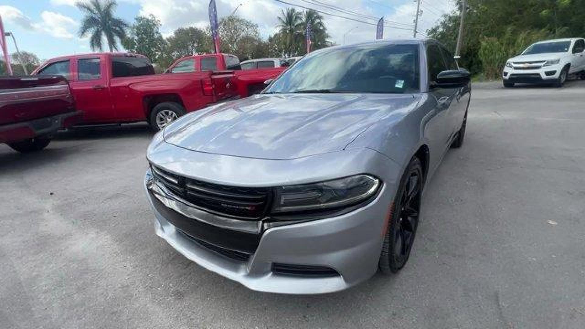 2016 Billet Clearcoat /Black Dodge Charger (2C3CDXBG4GH) with an 6 3.6 L engine, Automatic transmission, located at 27610 S Dixie Hwy, Homestead, FL, 33032, (305) 749-2348, 25.510241, -80.438301 - KBB.com 10 Best Used Cars Under $20,000. Only 69,245 Miles! Delivers 31 Highway MPG and 19 City MPG! This Dodge Charger delivers a Regular Unleaded V-6 3.6 L/220 engine powering this Automatic transmission. WHEELS: 20 X 8.0 GLOSS BLACK PAINTED ALUMINUM, TRANSMISSION: 8-SPEED AUTO (8HP45) (STD), TIRE - Photo#0