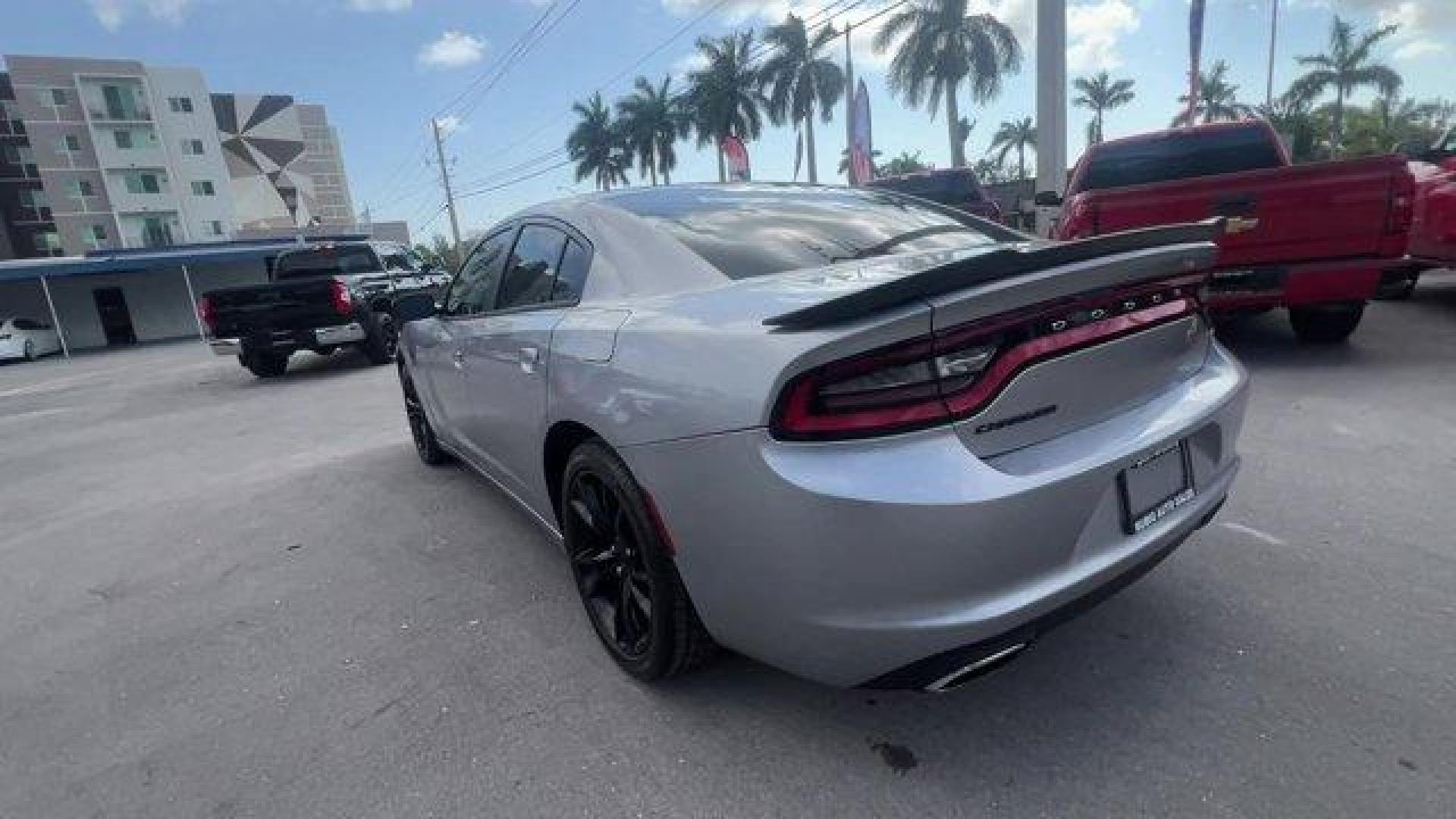 2016 Billet Clearcoat /Black Dodge Charger (2C3CDXBG4GH) with an 6 3.6 L engine, Automatic transmission, located at 27610 S Dixie Hwy, Homestead, FL, 33032, (305) 749-2348, 25.510241, -80.438301 - KBB.com 10 Best Used Cars Under $20,000. Only 69,245 Miles! Delivers 31 Highway MPG and 19 City MPG! This Dodge Charger delivers a Regular Unleaded V-6 3.6 L/220 engine powering this Automatic transmission. WHEELS: 20 X 8.0 GLOSS BLACK PAINTED ALUMINUM, TRANSMISSION: 8-SPEED AUTO (8HP45) (STD), TIRE - Photo#2