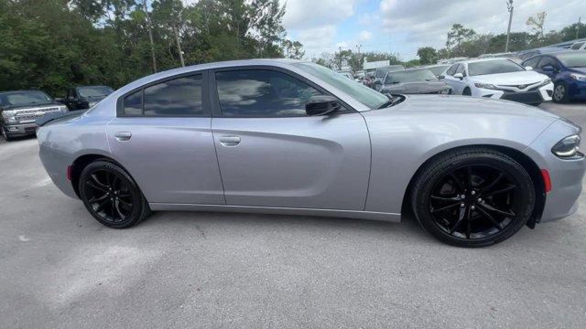 2016 Billet Clearcoat /Black Dodge Charger (2C3CDXBG4GH) with an 6 3.6 L engine, Automatic transmission, located at 27610 S Dixie Hwy, Homestead, FL, 33032, (305) 749-2348, 25.510241, -80.438301 - KBB.com 10 Best Used Cars Under $20,000. Only 69,245 Miles! Delivers 31 Highway MPG and 19 City MPG! This Dodge Charger delivers a Regular Unleaded V-6 3.6 L/220 engine powering this Automatic transmission. WHEELS: 20 X 8.0 GLOSS BLACK PAINTED ALUMINUM, TRANSMISSION: 8-SPEED AUTO (8HP45) (STD), TIRE - Photo#5