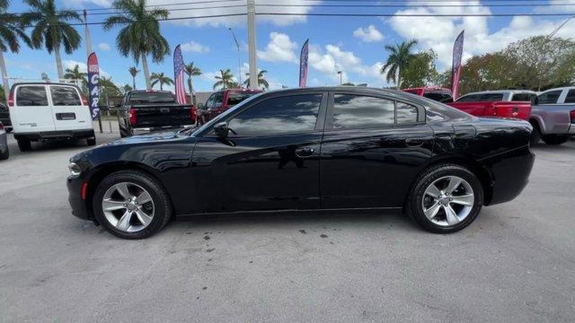 2016 Pitch Black Clearcoat /Black Dodge Charger (2C3CDXHG3GH) with an 6 3.6 L engine, Automatic transmission, located at 27610 S Dixie Hwy, Homestead, FL, 33032, (305) 749-2348, 25.510241, -80.438301 - KBB.com 10 Best Used Cars Under $20,000. Boasts 31 Highway MPG and 19 City MPG! This Dodge Charger boasts a Regular Unleaded V-6 3.6 L/220 engine powering this Automatic transmission. WHEELS: 18 X 7.5 CAST ALUMINUM (STD), TRANSMISSION: 8-SPEED AUTO (8HP45) (STD), TIRES: P235/55R18 AS PERFORMANCE (ST - Photo#0