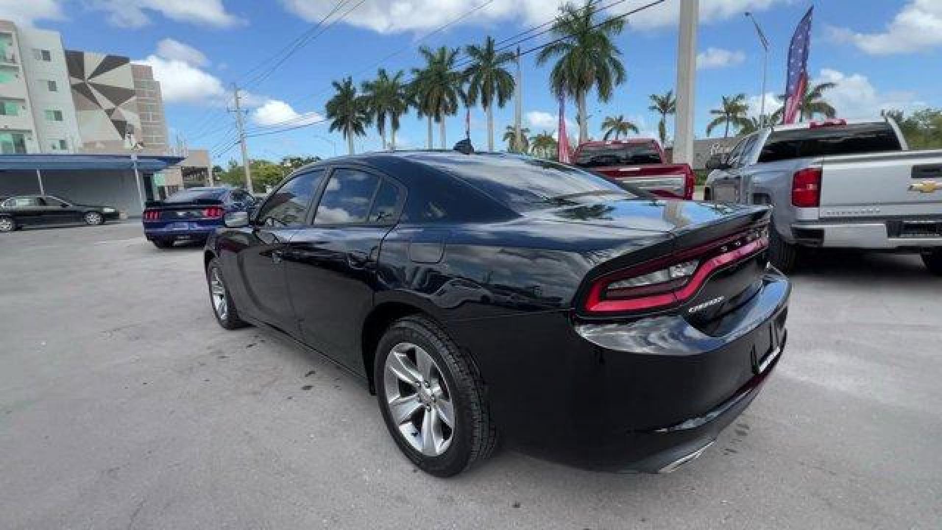 2016 Pitch Black Clearcoat /Black Dodge Charger (2C3CDXHG3GH) with an 6 3.6 L engine, Automatic transmission, located at 27610 S Dixie Hwy, Homestead, FL, 33032, (305) 749-2348, 25.510241, -80.438301 - KBB.com 10 Best Used Cars Under $20,000. Boasts 31 Highway MPG and 19 City MPG! This Dodge Charger boasts a Regular Unleaded V-6 3.6 L/220 engine powering this Automatic transmission. WHEELS: 18 X 7.5 CAST ALUMINUM (STD), TRANSMISSION: 8-SPEED AUTO (8HP45) (STD), TIRES: P235/55R18 AS PERFORMANCE (ST - Photo#1