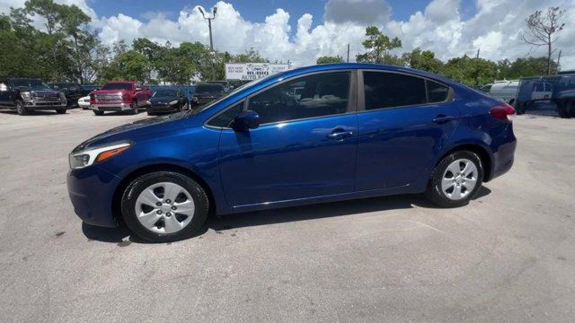 2018 Deep Sea Blue /Black Kia Forte (3KPFK4A74JE) with an 4 2.0 L engine, Automatic transmission, located at 27610 S Dixie Hwy, Homestead, FL, 33032, (305) 749-2348, 25.510241, -80.438301 - Scores 37 Highway MPG and 29 City MPG! This Kia Forte delivers a Regular Unleaded I-4 2.0 L/122 engine powering this Automatic transmission. DEEP SEA BLUE, CARPETED FLOOR MATS, BLACK, PREMIUM CLOTH SEAT TRIM.* This Kia Forte Features the Following Options *BLACK, CLOTH SEAT TRIM, Window Grid Antenna - Photo#1