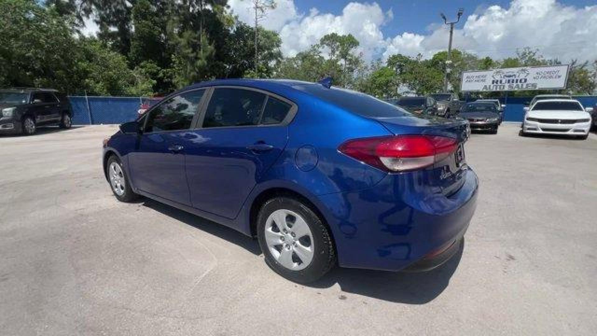 2018 Deep Sea Blue /Black Kia Forte (3KPFK4A74JE) with an 4 2.0 L engine, Automatic transmission, located at 27610 S Dixie Hwy, Homestead, FL, 33032, (305) 749-2348, 25.510241, -80.438301 - Scores 37 Highway MPG and 29 City MPG! This Kia Forte delivers a Regular Unleaded I-4 2.0 L/122 engine powering this Automatic transmission. DEEP SEA BLUE, CARPETED FLOOR MATS, BLACK, PREMIUM CLOTH SEAT TRIM.* This Kia Forte Features the Following Options *BLACK, CLOTH SEAT TRIM, Window Grid Antenna - Photo#2