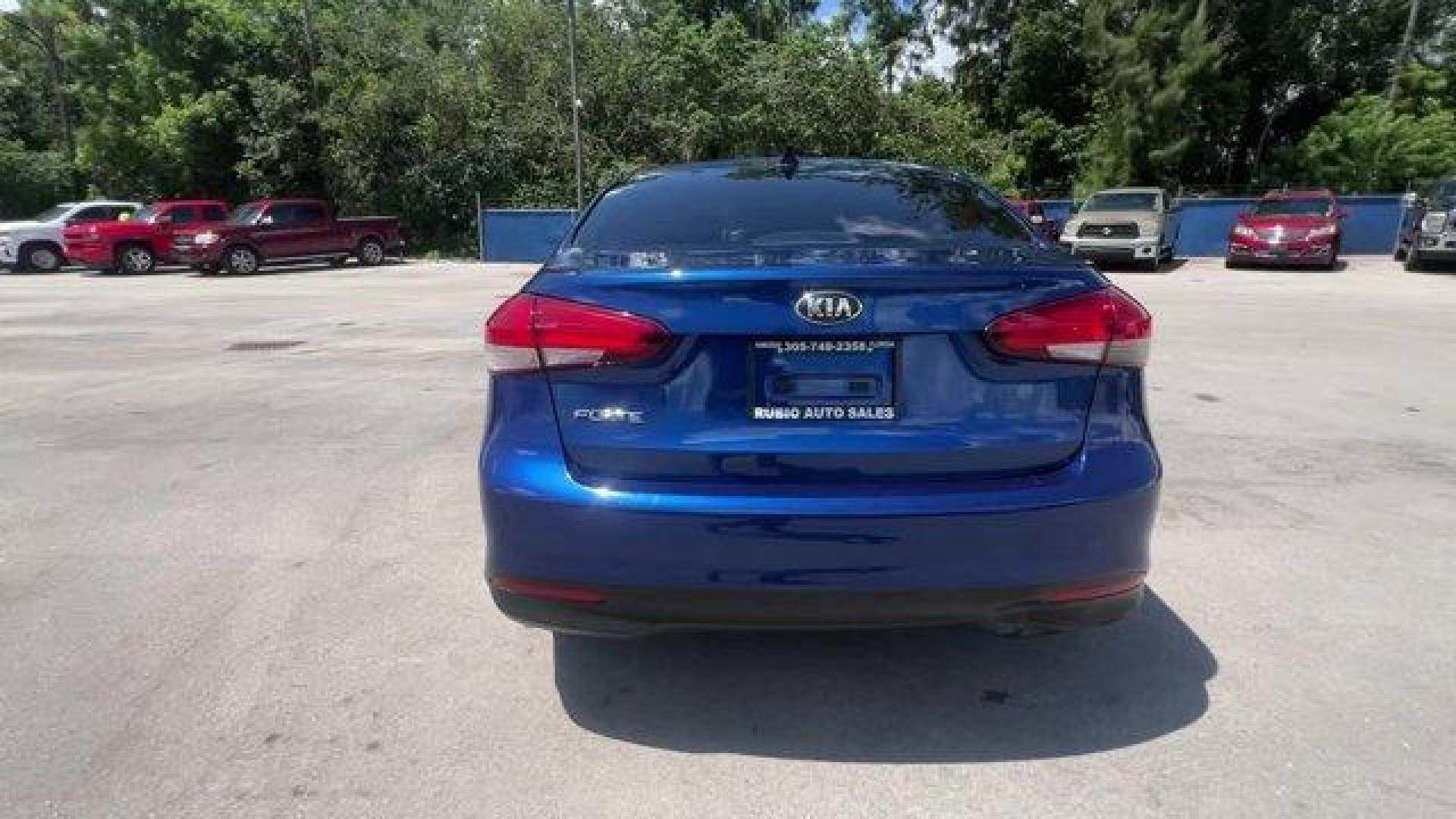 2018 Deep Sea Blue /Black Kia Forte (3KPFK4A74JE) with an 4 2.0 L engine, Automatic transmission, located at 27610 S Dixie Hwy, Homestead, FL, 33032, (305) 749-2348, 25.510241, -80.438301 - Scores 37 Highway MPG and 29 City MPG! This Kia Forte delivers a Regular Unleaded I-4 2.0 L/122 engine powering this Automatic transmission. DEEP SEA BLUE, CARPETED FLOOR MATS, BLACK, PREMIUM CLOTH SEAT TRIM.* This Kia Forte Features the Following Options *BLACK, CLOTH SEAT TRIM, Window Grid Antenna - Photo#3