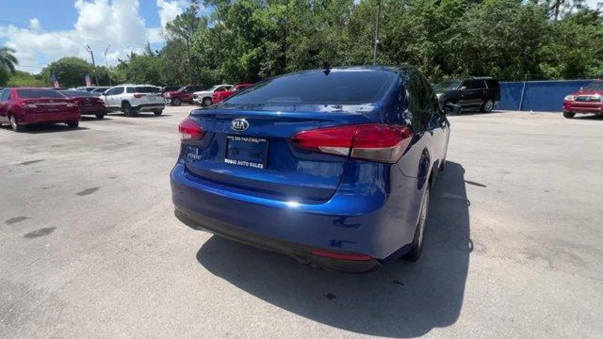 2018 Deep Sea Blue /Black Kia Forte (3KPFK4A74JE) with an 4 2.0 L engine, Automatic transmission, located at 27610 S Dixie Hwy, Homestead, FL, 33032, (305) 749-2348, 25.510241, -80.438301 - Scores 37 Highway MPG and 29 City MPG! This Kia Forte delivers a Regular Unleaded I-4 2.0 L/122 engine powering this Automatic transmission. DEEP SEA BLUE, CARPETED FLOOR MATS, BLACK, PREMIUM CLOTH SEAT TRIM.* This Kia Forte Features the Following Options *BLACK, CLOTH SEAT TRIM, Window Grid Antenna - Photo#4