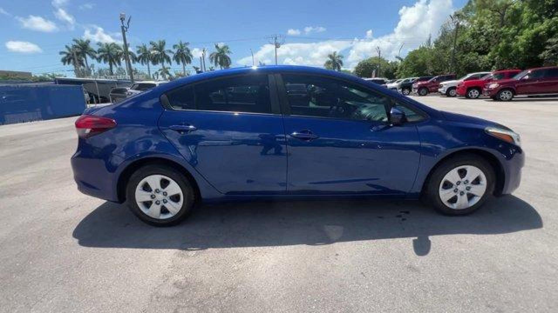 2018 Deep Sea Blue /Black Kia Forte (3KPFK4A74JE) with an 4 2.0 L engine, Automatic transmission, located at 27610 S Dixie Hwy, Homestead, FL, 33032, (305) 749-2348, 25.510241, -80.438301 - Scores 37 Highway MPG and 29 City MPG! This Kia Forte delivers a Regular Unleaded I-4 2.0 L/122 engine powering this Automatic transmission. DEEP SEA BLUE, CARPETED FLOOR MATS, BLACK, PREMIUM CLOTH SEAT TRIM.* This Kia Forte Features the Following Options *BLACK, CLOTH SEAT TRIM, Window Grid Antenna - Photo#5