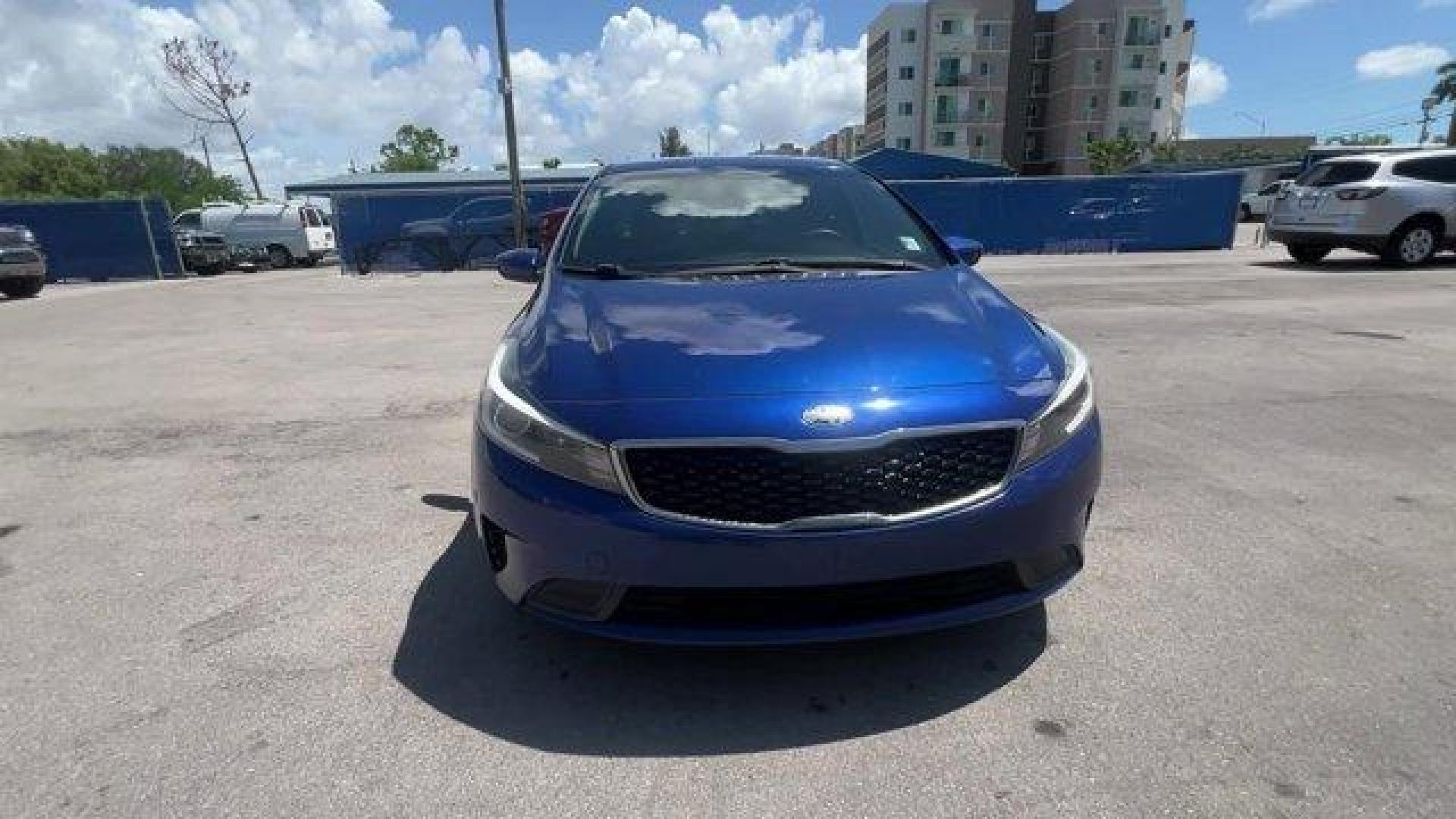 2018 Deep Sea Blue /Black Kia Forte (3KPFK4A74JE) with an 4 2.0 L engine, Automatic transmission, located at 27610 S Dixie Hwy, Homestead, FL, 33032, (305) 749-2348, 25.510241, -80.438301 - Scores 37 Highway MPG and 29 City MPG! This Kia Forte delivers a Regular Unleaded I-4 2.0 L/122 engine powering this Automatic transmission. DEEP SEA BLUE, CARPETED FLOOR MATS, BLACK, PREMIUM CLOTH SEAT TRIM.* This Kia Forte Features the Following Options *BLACK, CLOTH SEAT TRIM, Window Grid Antenna - Photo#7