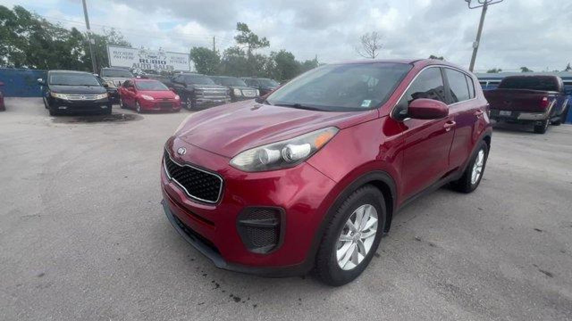 2017 Hyper Red /Black Kia Sportage (KNDPM3AC6H7) with an 4 2.4 L engine, Automatic transmission, located at 27610 S Dixie Hwy, Homestead, FL, 33032, (305) 749-2348, 25.510241, -80.438301 - IIHS Top Safety Pick, Top Safety Pick+. Delivers 30 Highway MPG and 23 City MPG! This Kia Sportage boasts a Regular Unleaded I-4 2.4 L/144 engine powering this Automatic transmission. WHEEL LOCKS, HYPER RED, CARPET FLOOR MATS.* This Kia Sportage Features the Following Options *BLACK, CLOTH SEAT TRIM - Photo#0