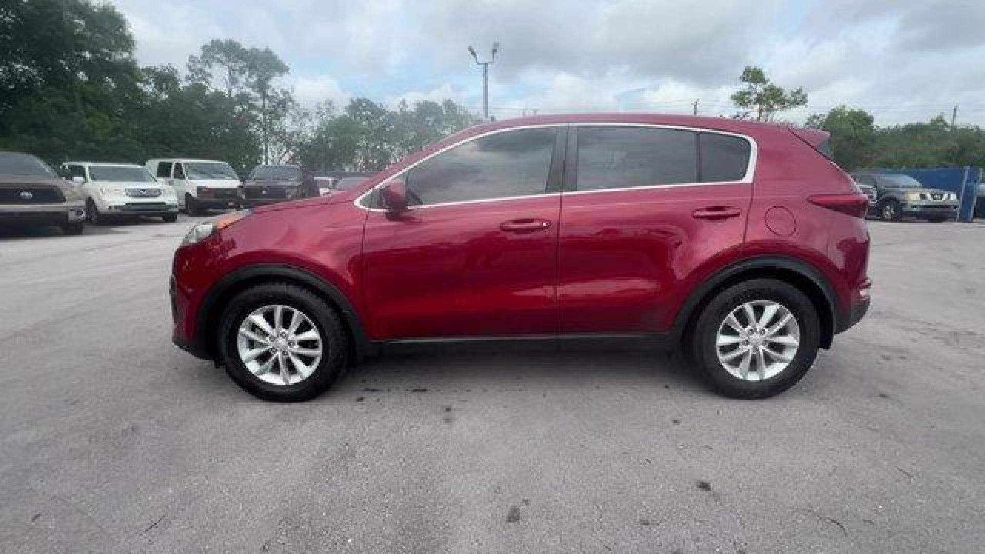 2017 Hyper Red /Black Kia Sportage (KNDPM3AC6H7) with an 4 2.4 L engine, Automatic transmission, located at 27610 S Dixie Hwy, Homestead, FL, 33032, (305) 749-2348, 25.510241, -80.438301 - IIHS Top Safety Pick, Top Safety Pick+. Delivers 30 Highway MPG and 23 City MPG! This Kia Sportage boasts a Regular Unleaded I-4 2.4 L/144 engine powering this Automatic transmission. WHEEL LOCKS, HYPER RED, CARPET FLOOR MATS.* This Kia Sportage Features the Following Options *BLACK, CLOTH SEAT TRIM - Photo#1